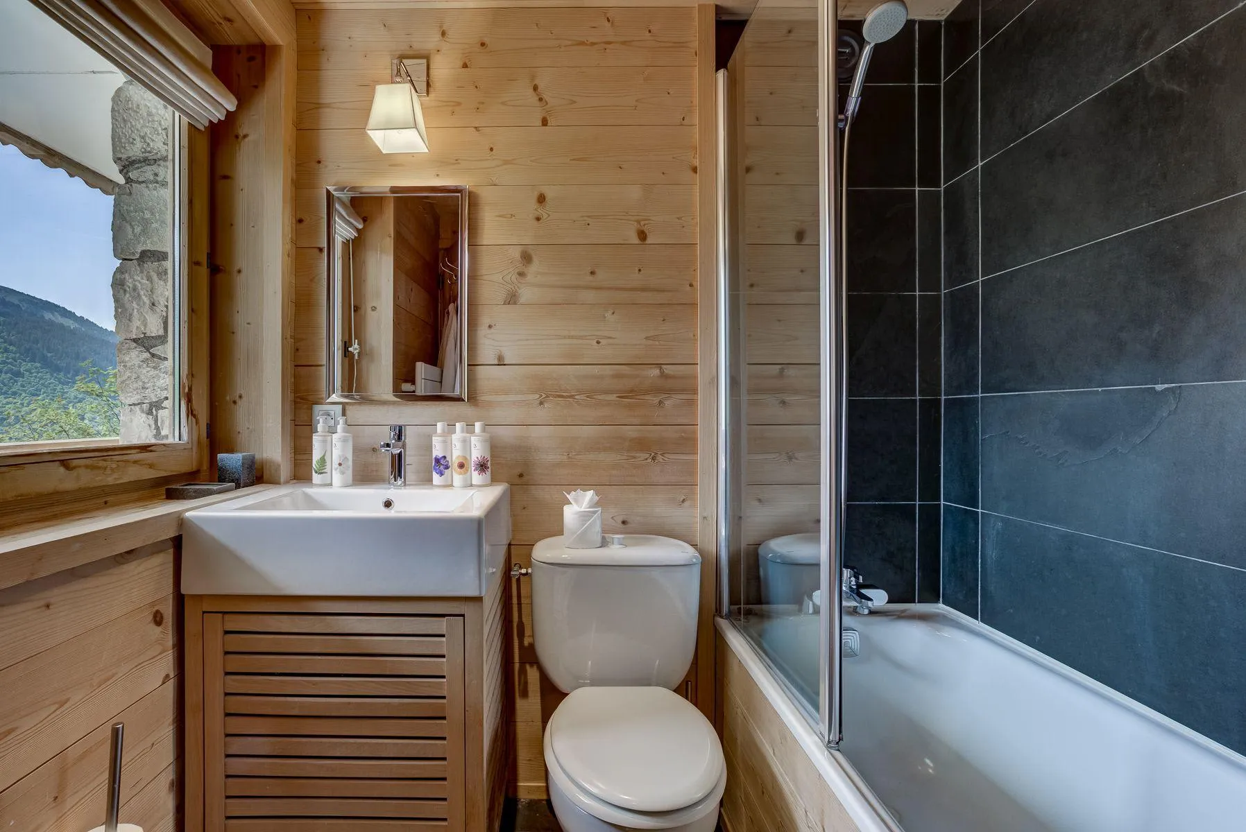 Timber bathroom with a walk-in shower and mountain view