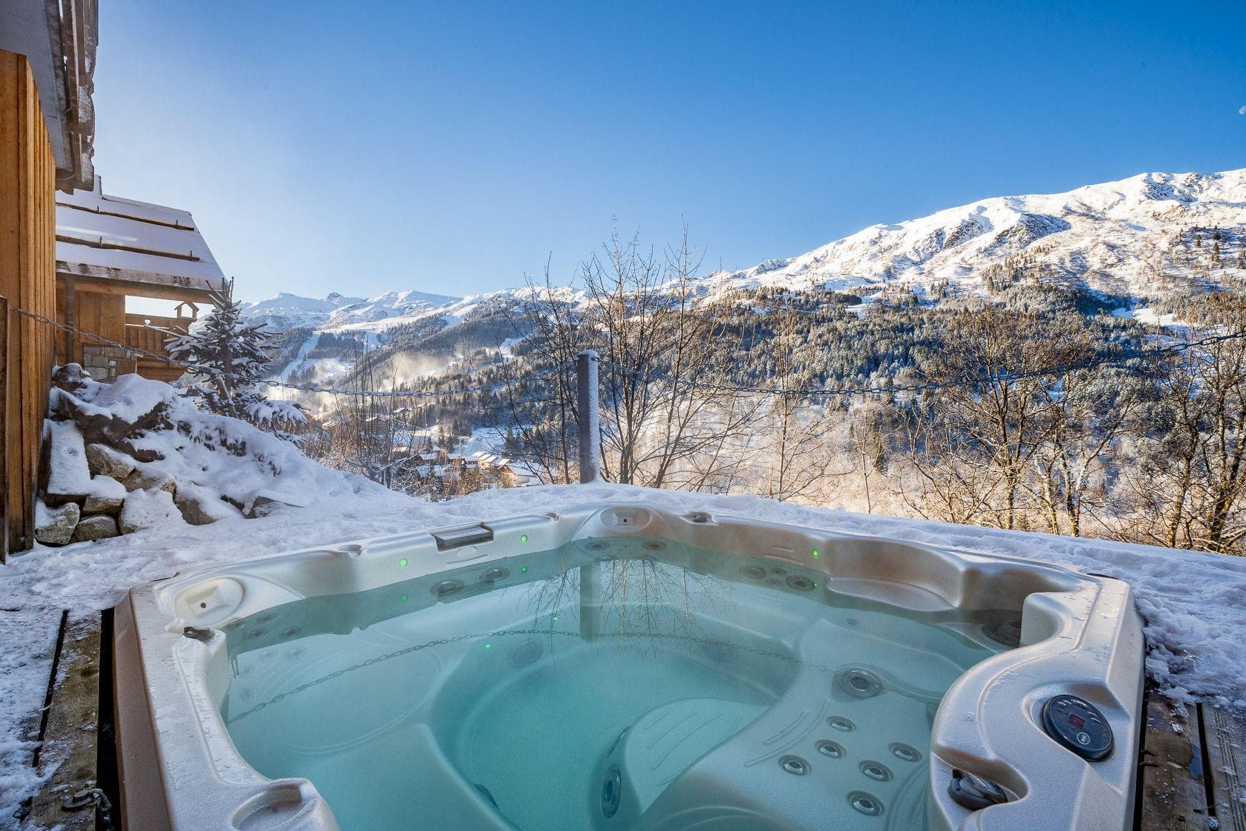 Outdoor hot tub seats 6; panoramic mountain and ski slope views