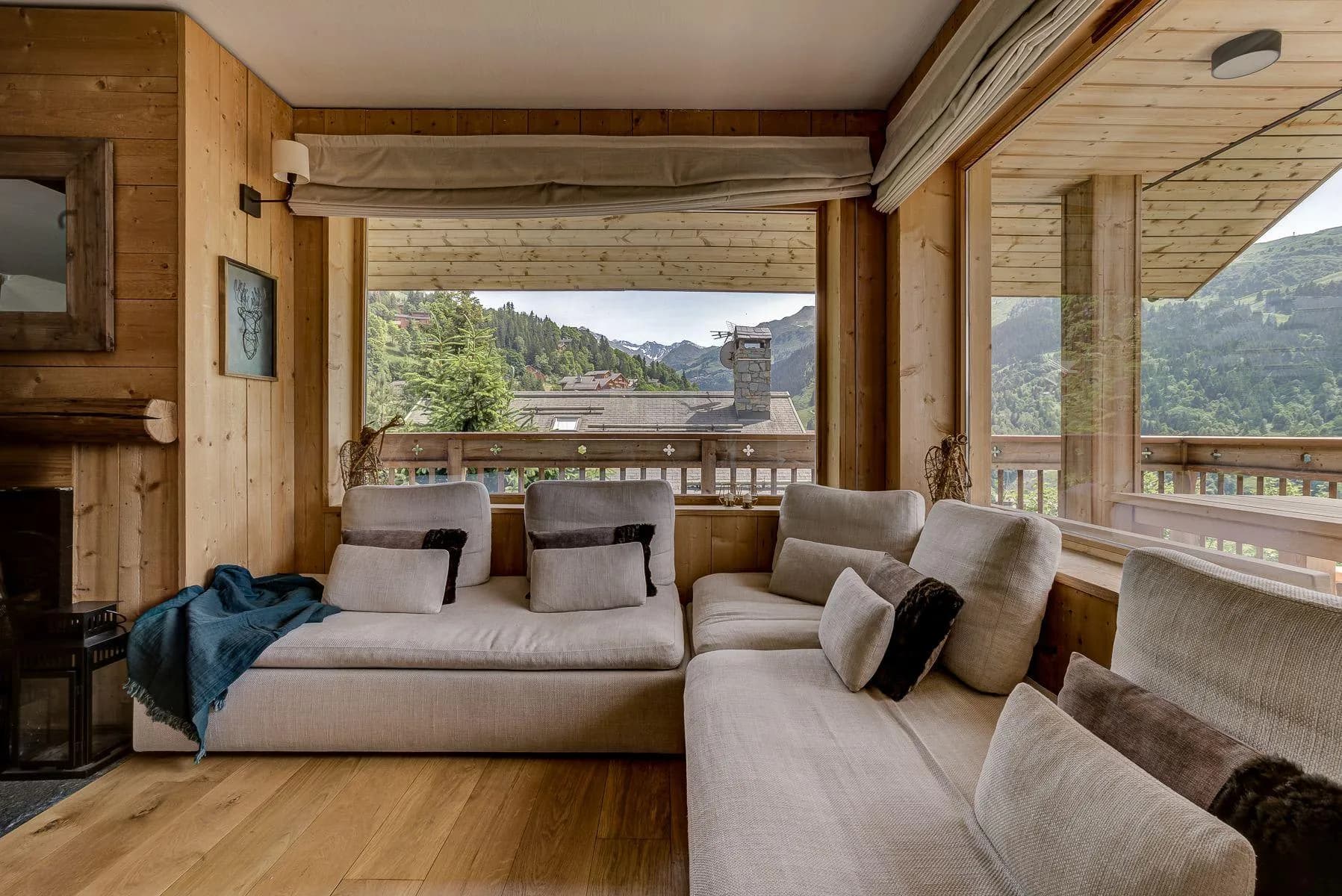 Mountain-view lounge with wraparound seating and an open fireplace