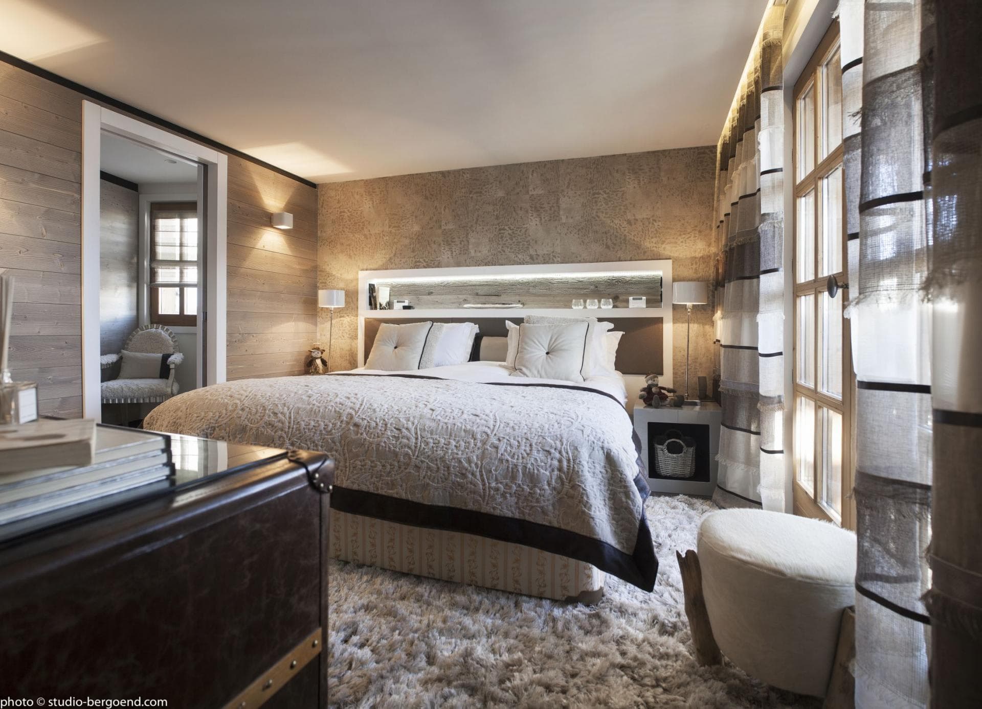 Bedroom with king bed and built-in headboard storage