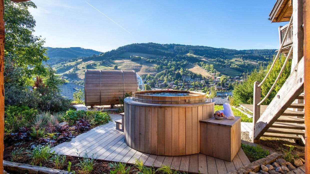 Cedar hot tub and barrel sauna with mountain valley views