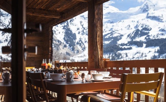 Covered balcony with outdoor dining for 6 and mountain views
