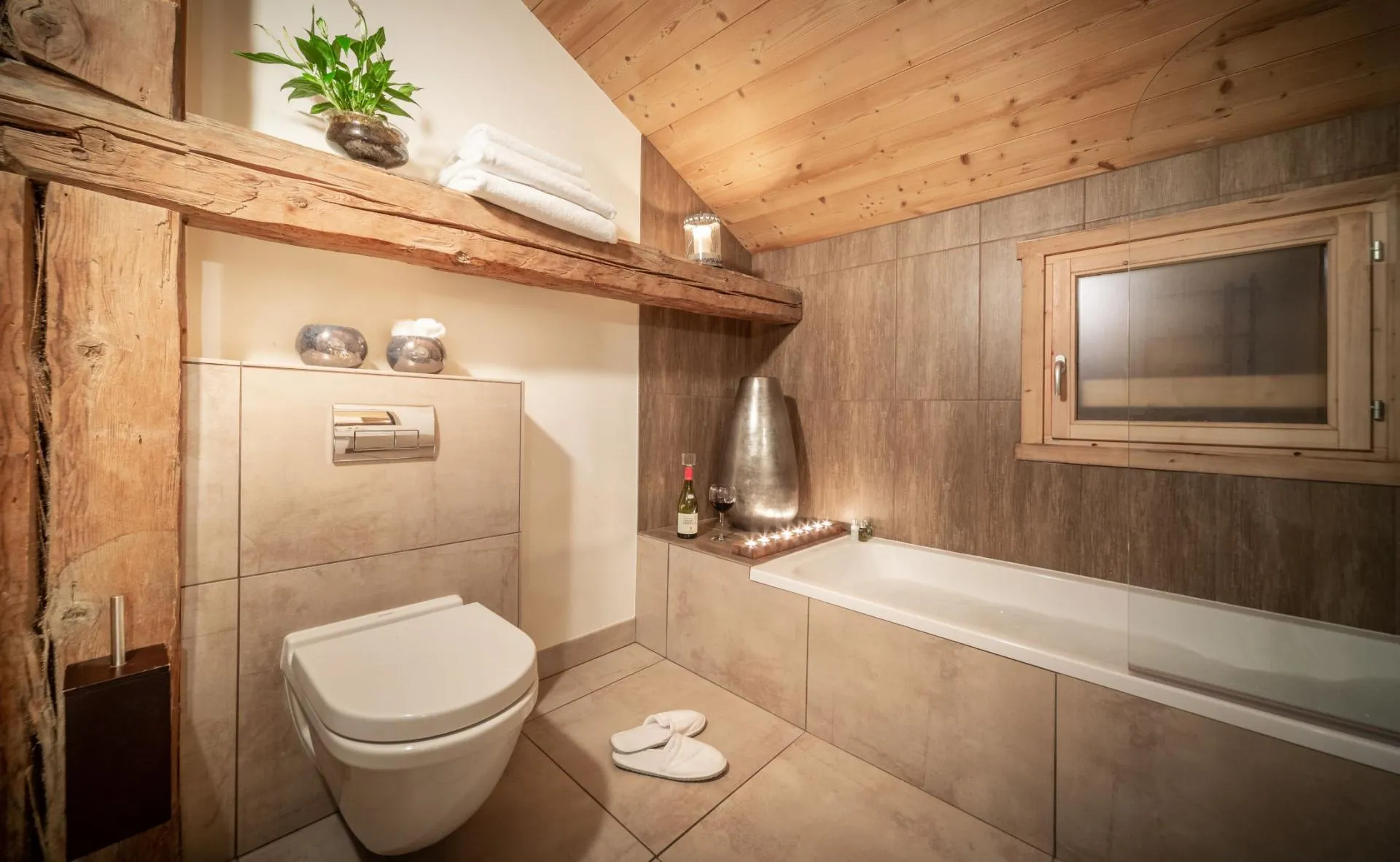En-suite bathroom with soaking tub and exposed timber beams
