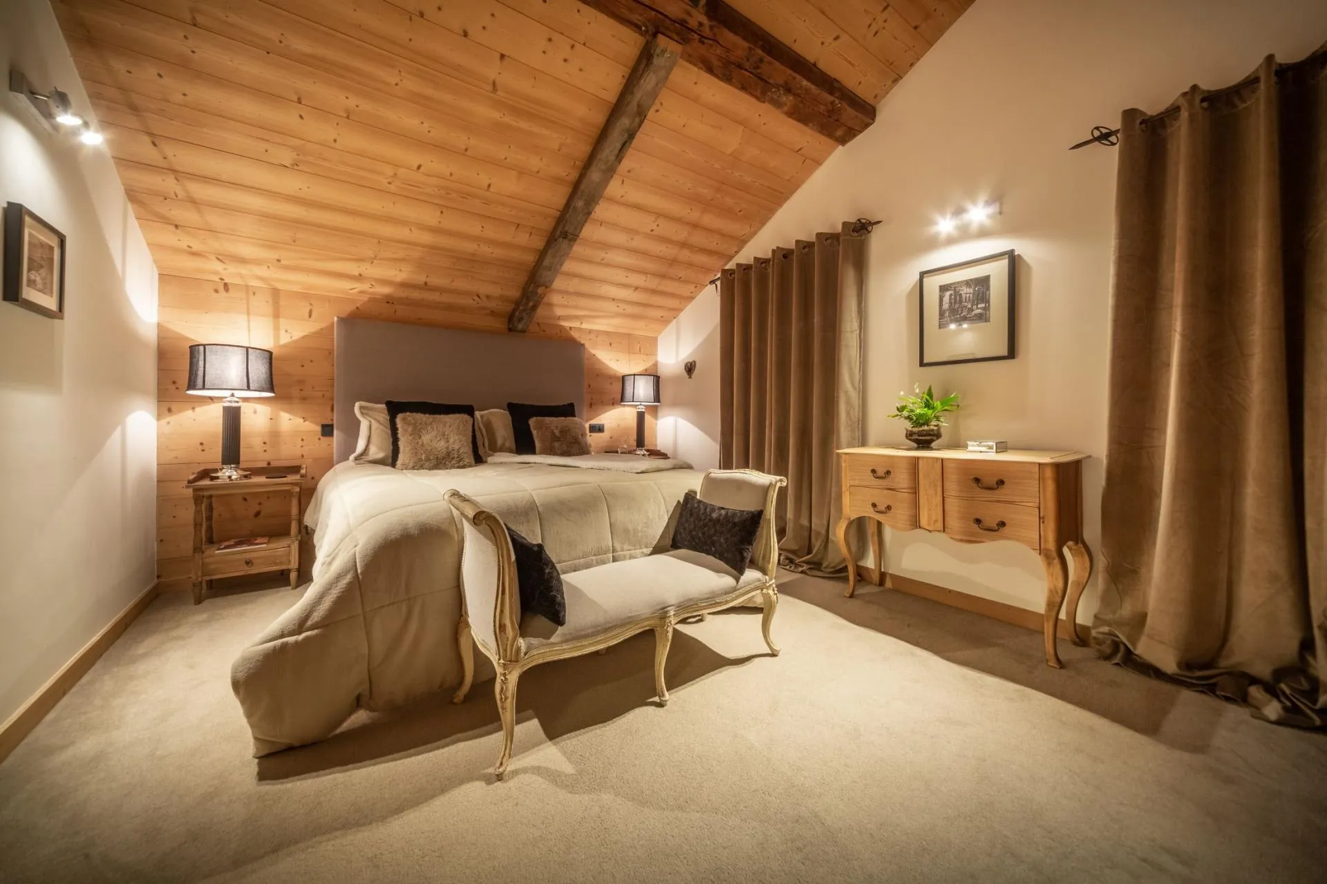 Bedroom with king bed and vaulted timber ceiling