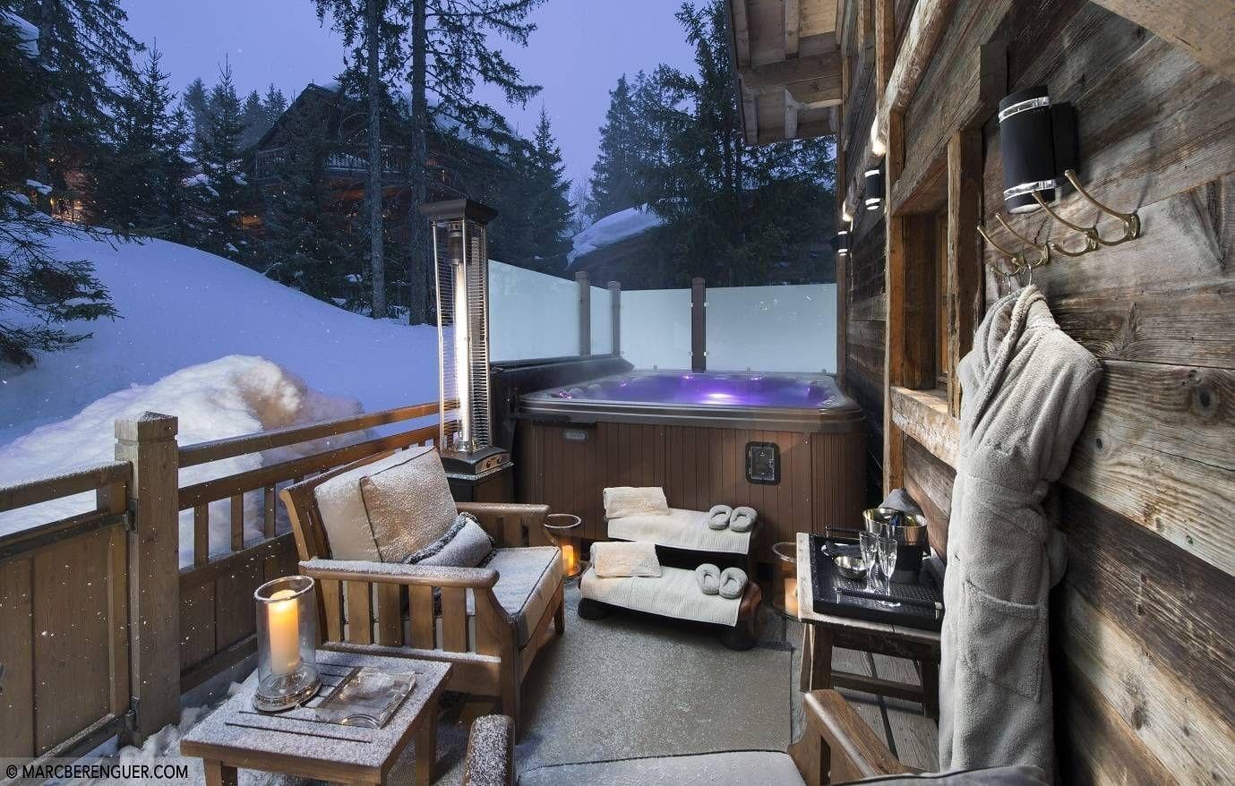 Private deck with heated spa and outdoor lounge seating