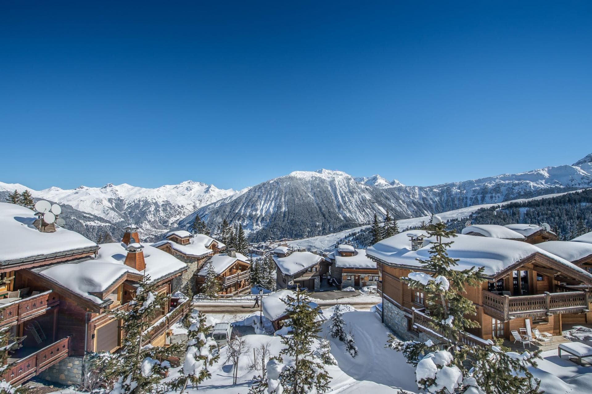 Balcony view of French Alps and snow-covered chalet village