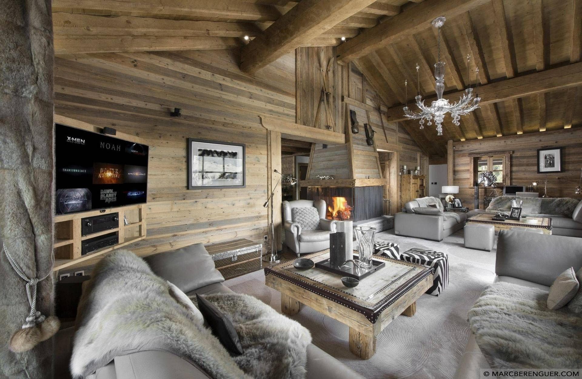Living area with wood-burning fireplace and smart TV with streaming apps