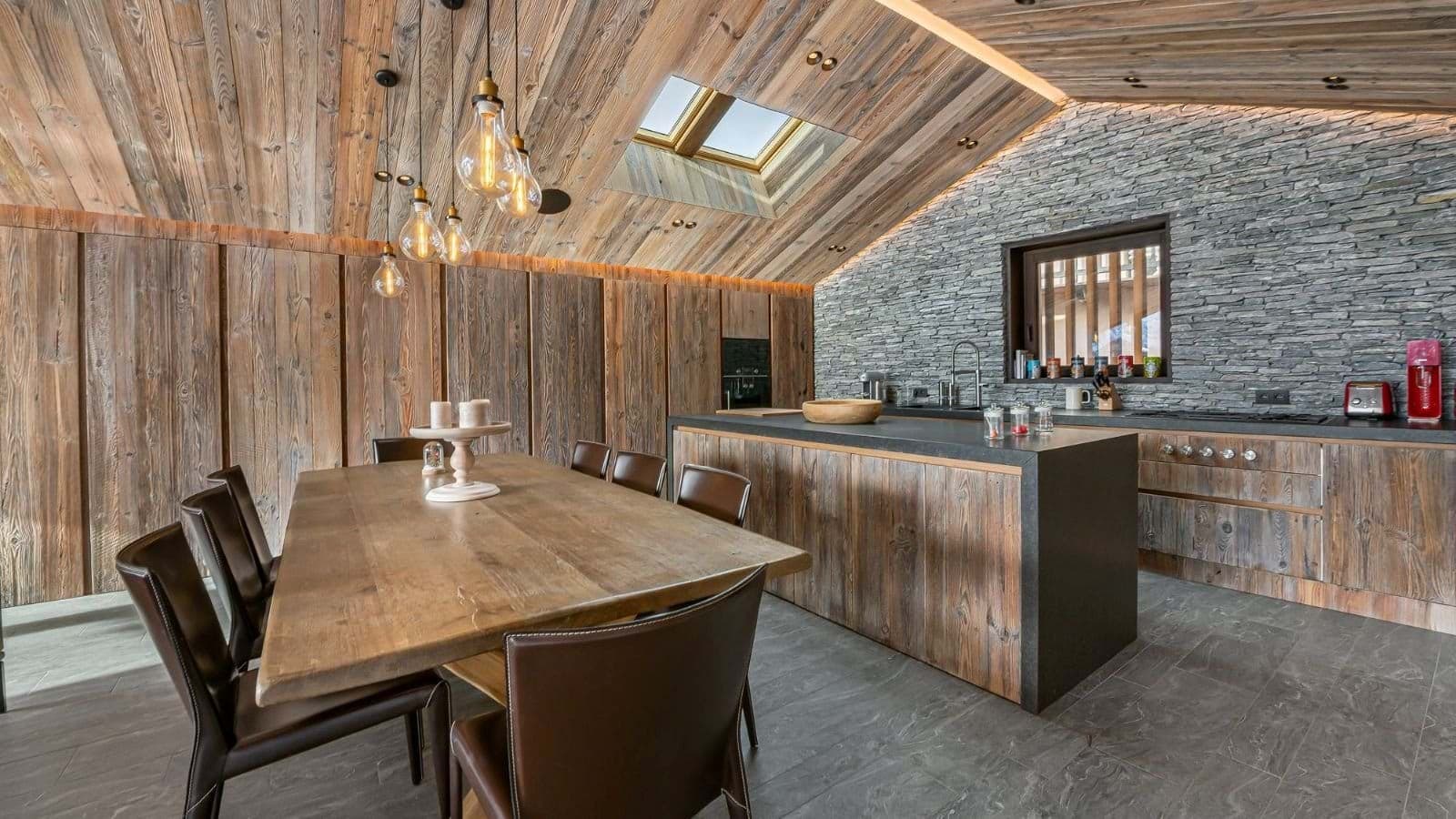 Open-plan kitchen and dining area with skylight and seating for 8