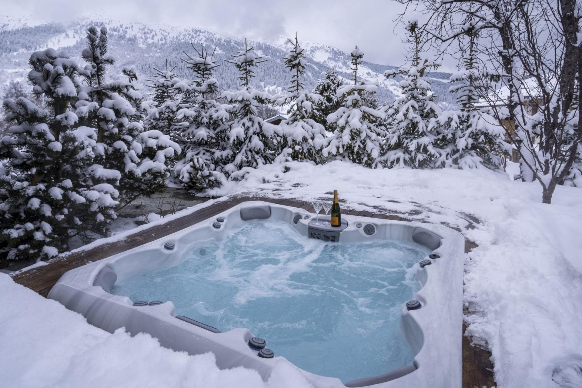 Outdoor hot tub seats 6; mountain and forest views