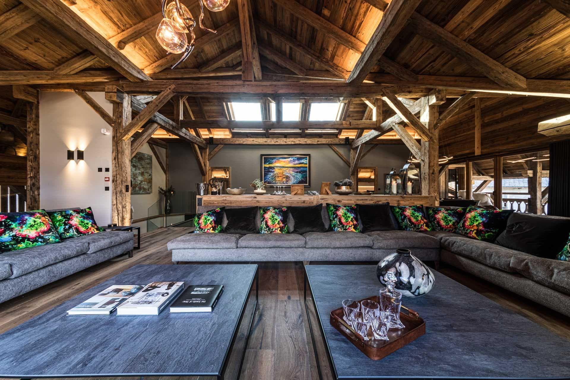 Living area with reclaimed wood beams and seating for 12