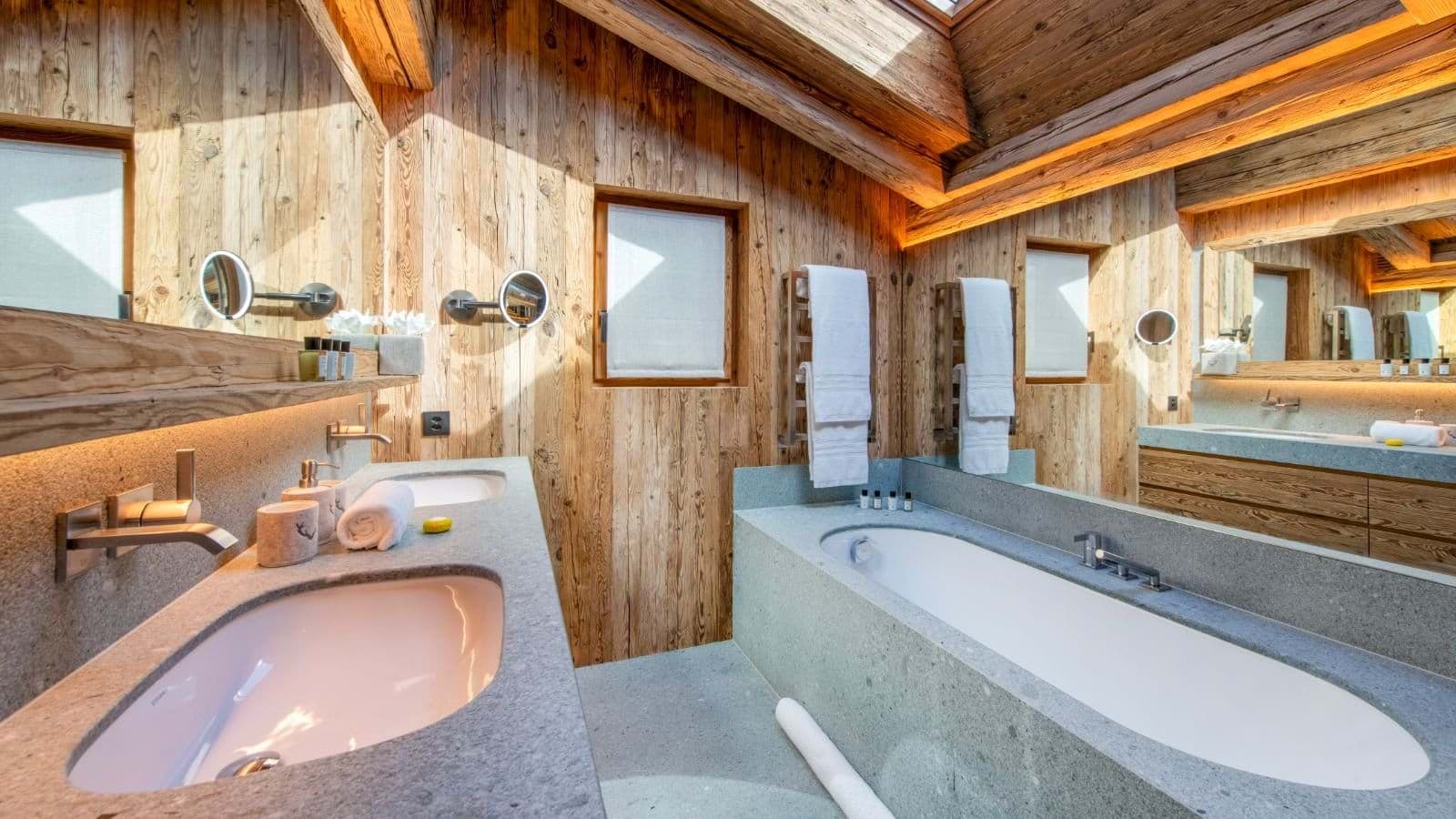 Bathroom with dual vanity and soaking tub under skylight