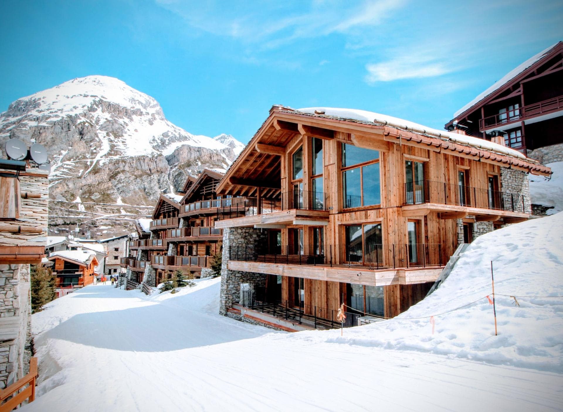 Timber chalet exterior with direct ski-in/ski-out access to slopes