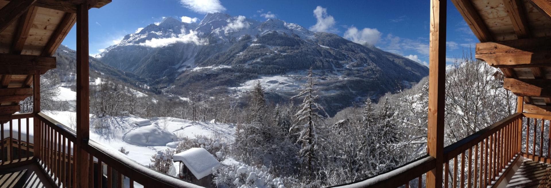 Covered balcony with panoramic mountain and valley views
