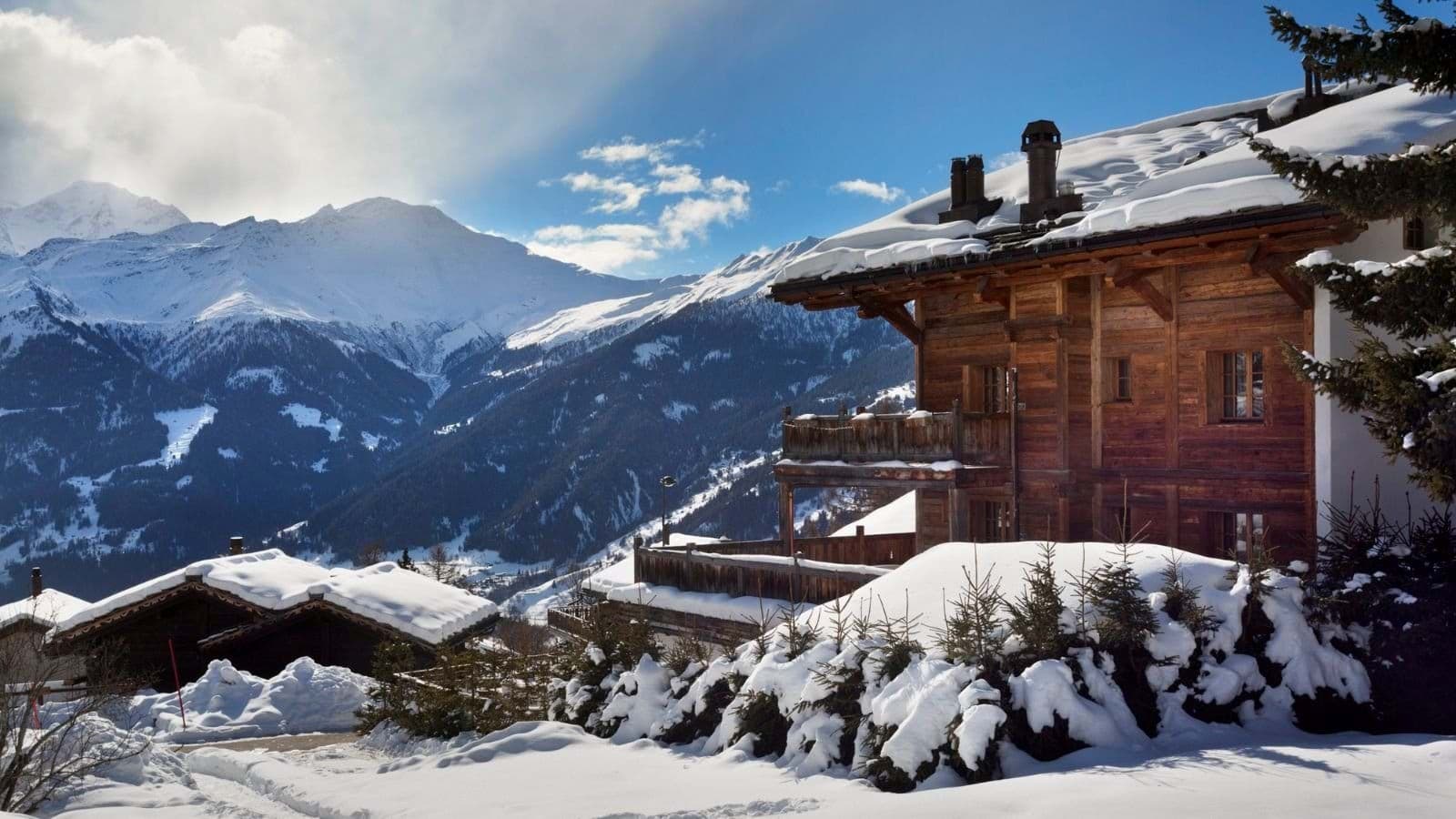 Chalet exterior featuring private balconies and panoramic mountain valley views