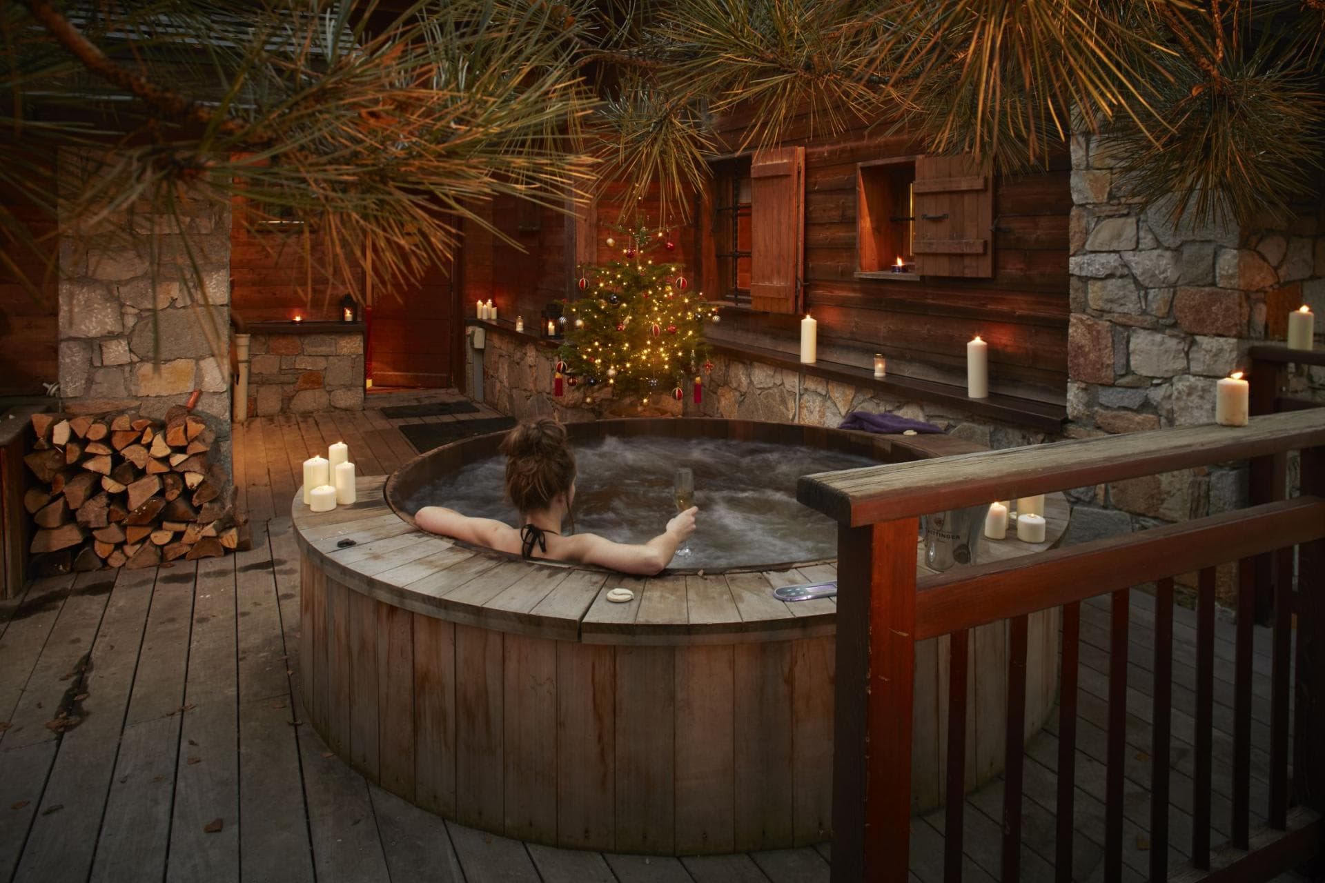 Cedar hot tub on private deck with wood-burning heating