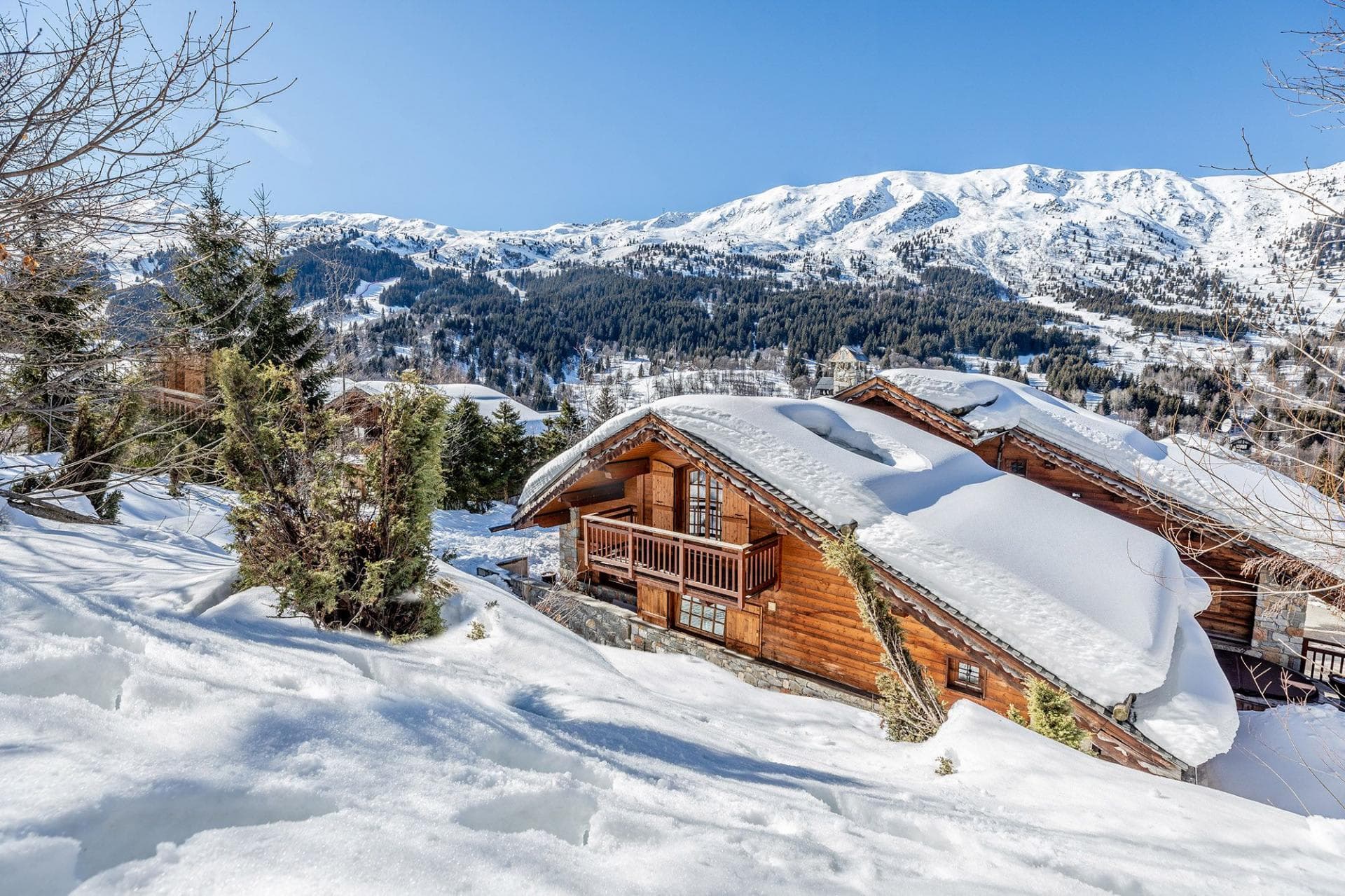 Chalet exterior with private balcony and direct views of Meribel ski slopes
