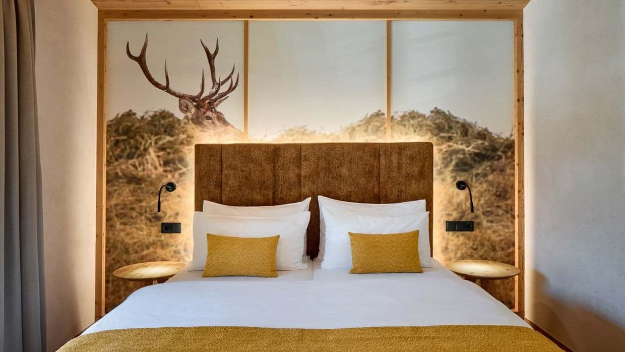 Guest bedroom with king bed and integrated reading lights