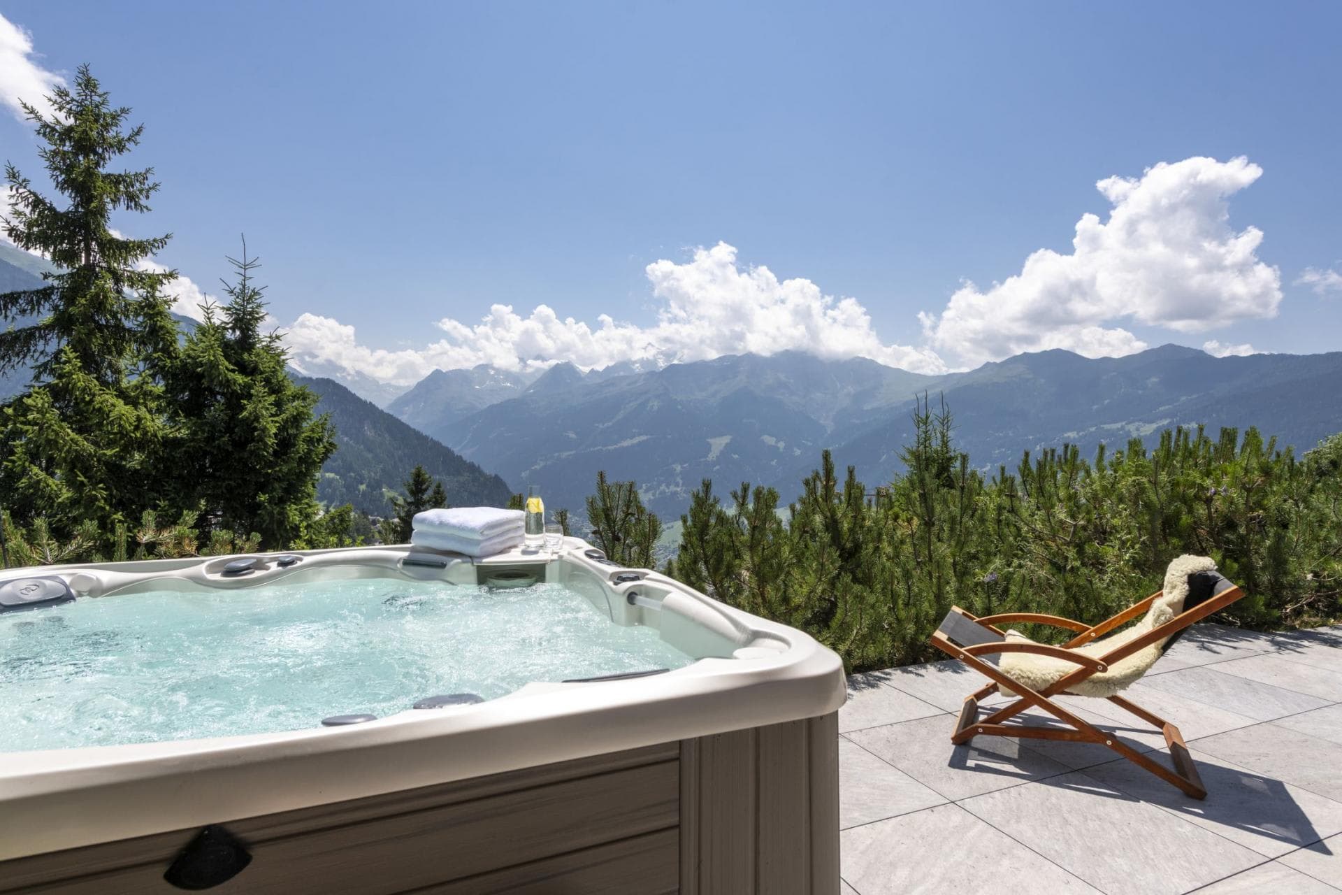 Outdoor hot tub seats 6 with panoramic Alpine valley views