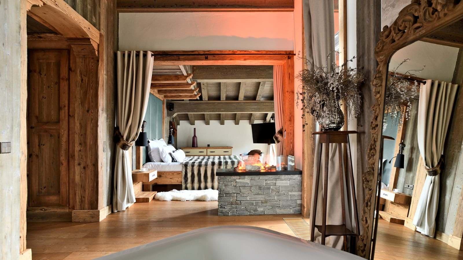 Primary suite with freestanding tub and double-sided fireplace