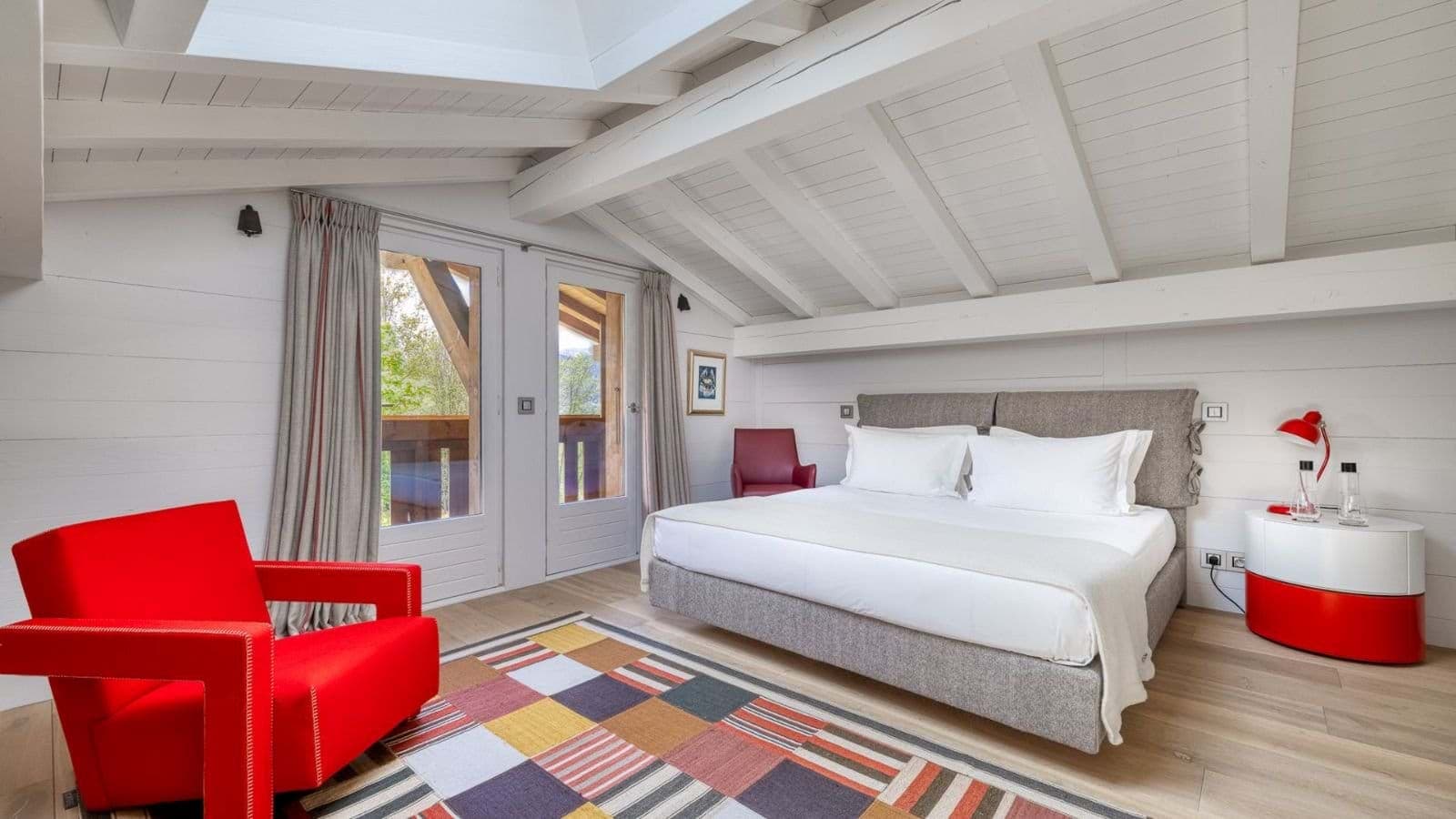 Loft bedroom with king bed and private balcony access