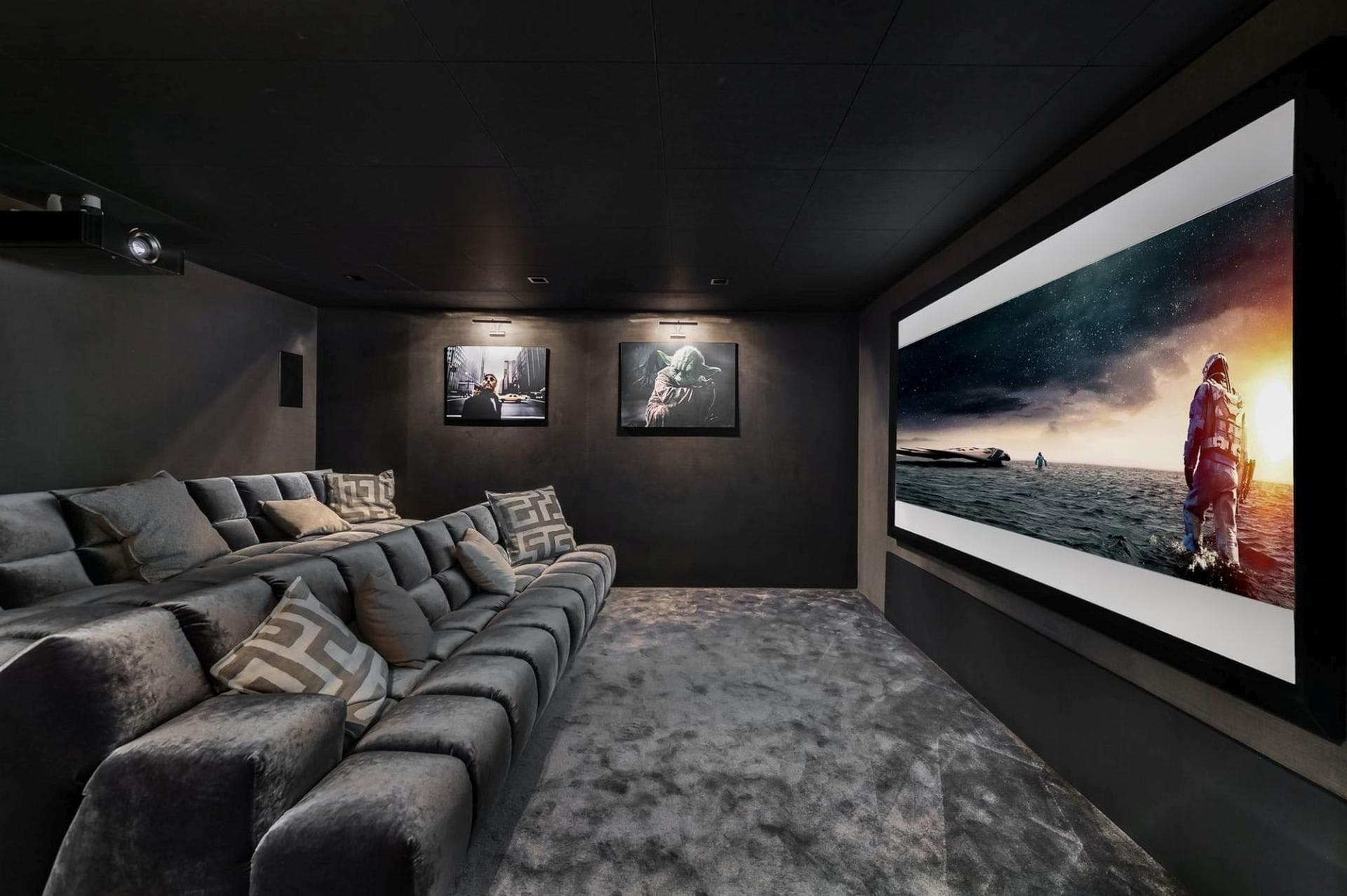 Private cinema with tiered sectional seating and 4K projector system
