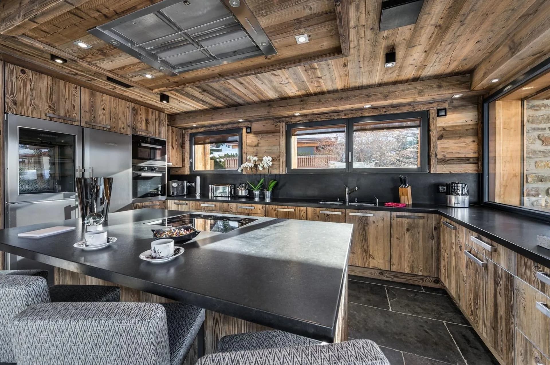 Kitchen island beneath timber beams