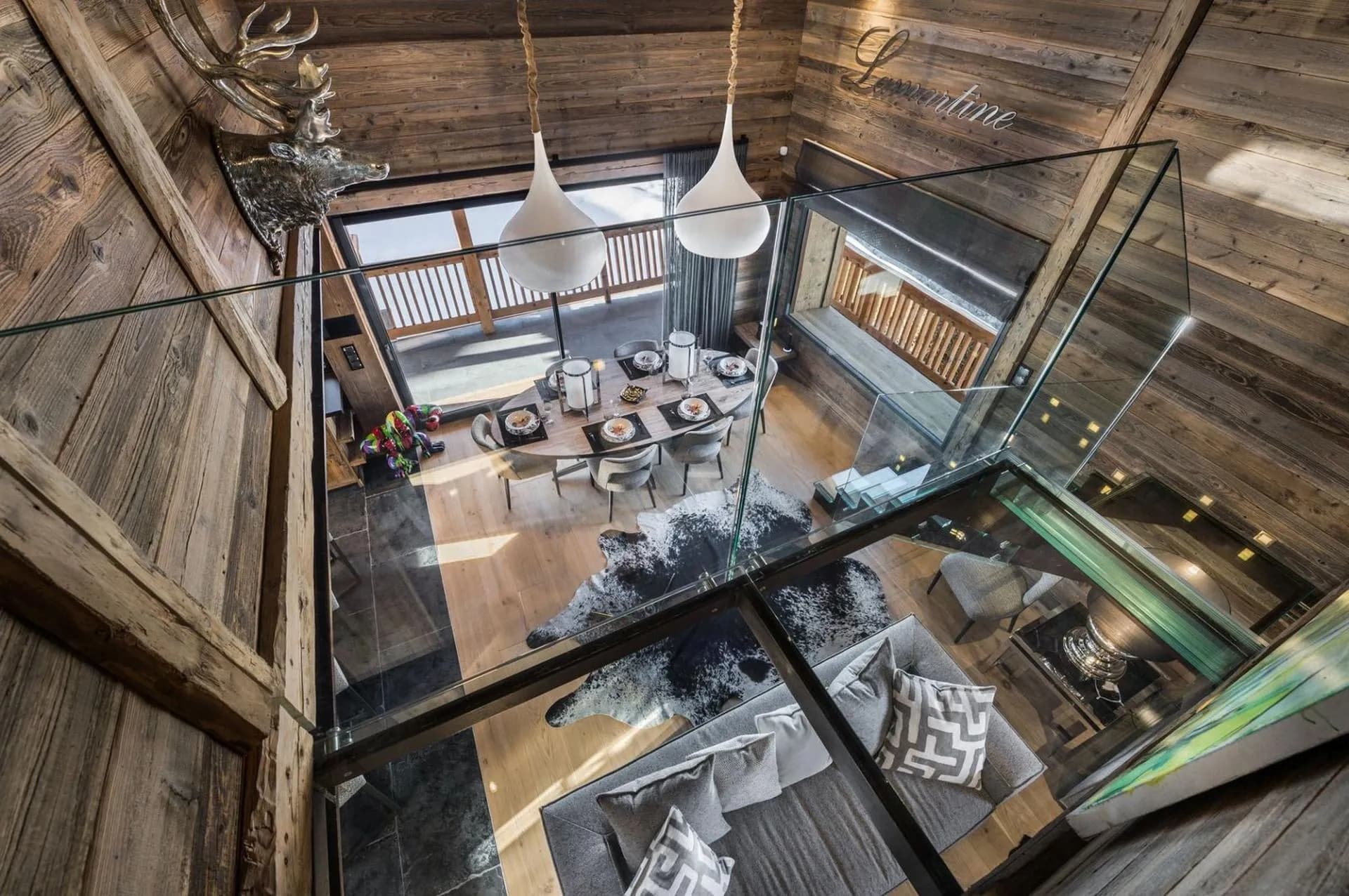 Glass staircase overlooking the dining room