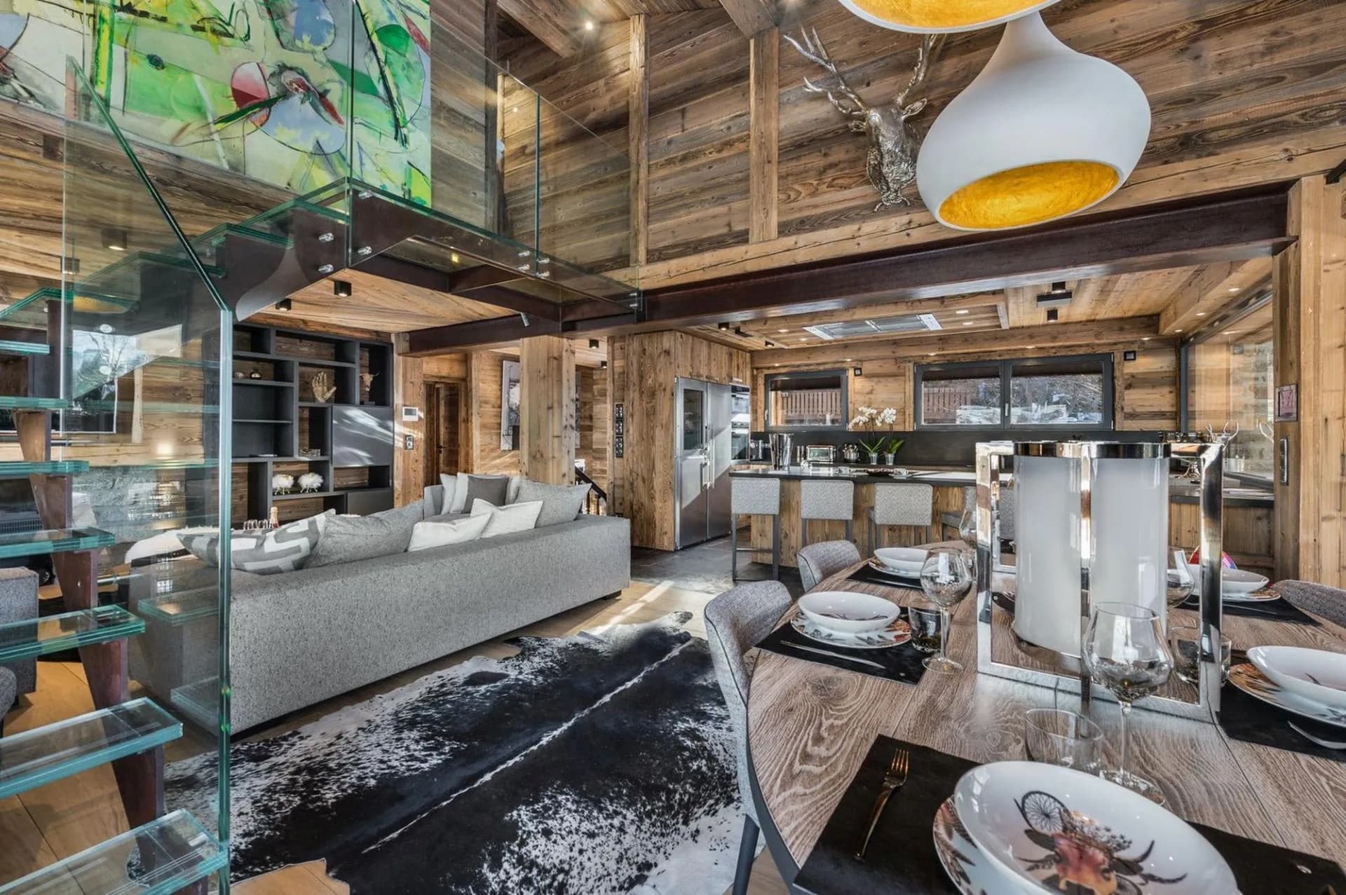 Living and dining area beneath the glass staircase