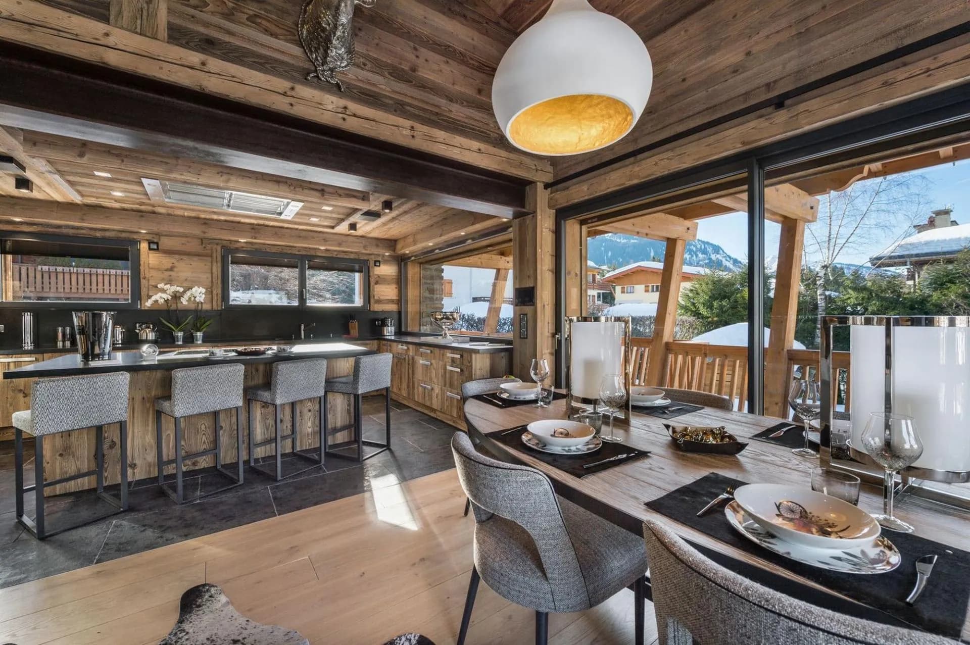 Dining table beside the fitted kitchen