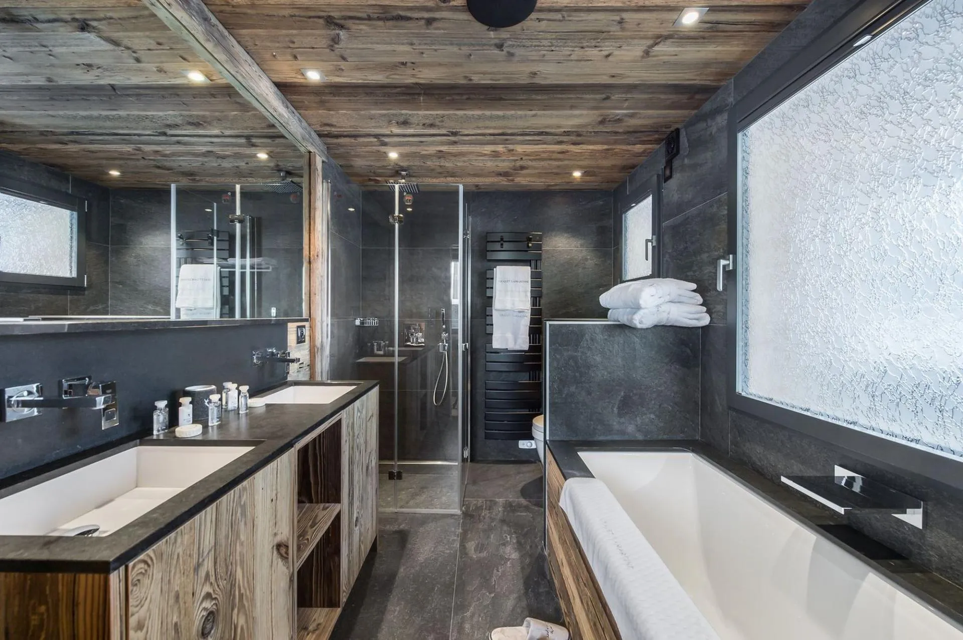 Bathroom with bath, shower and double basins