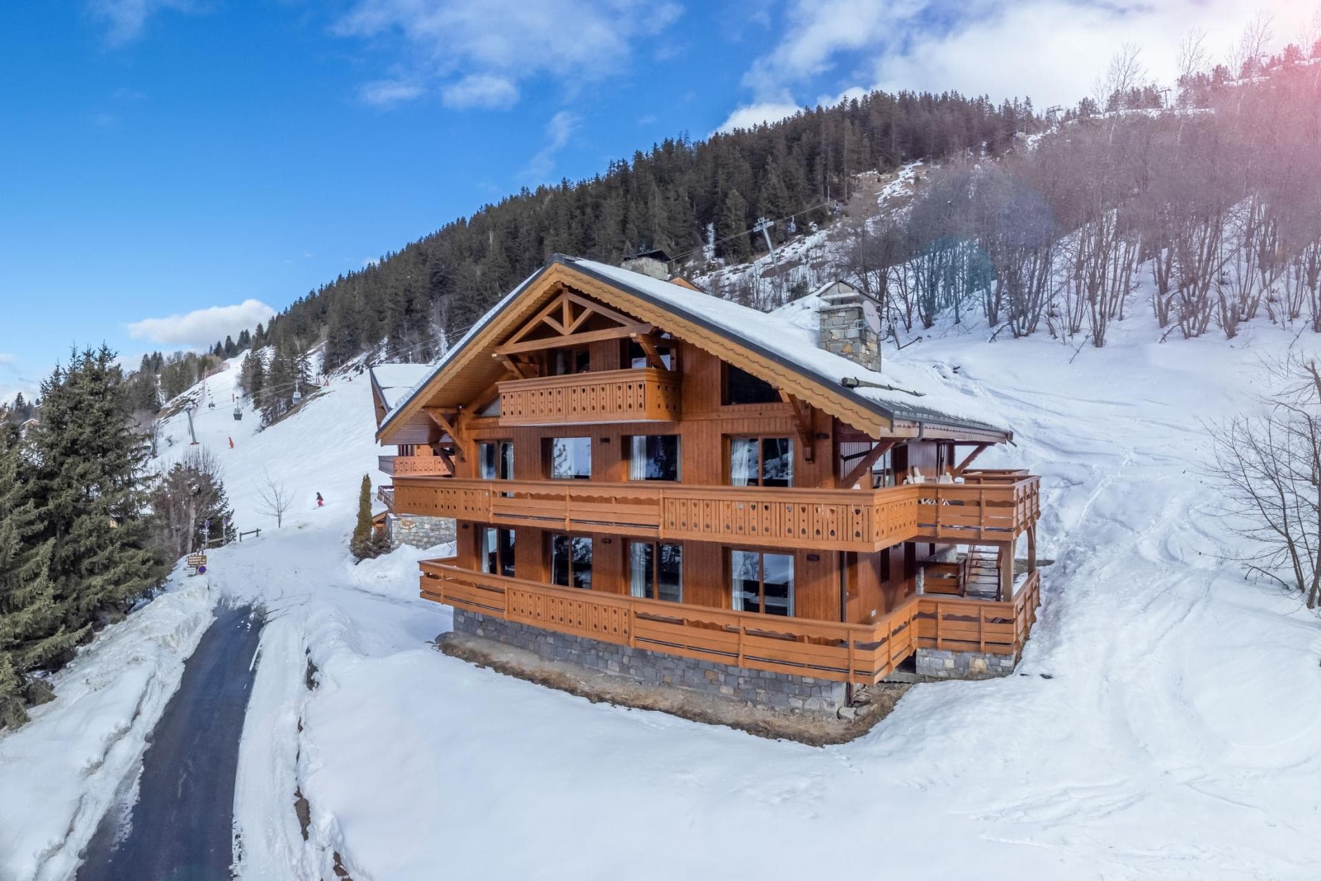 Ski-in/ski-out chalet exterior with private balconies and mountain views