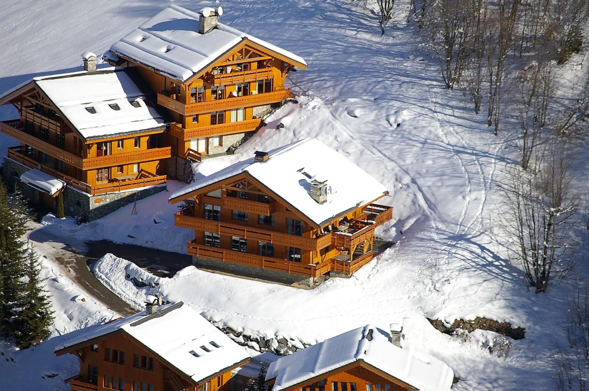 Ski-in/ski-out timber chalets with private balconies and mountain views