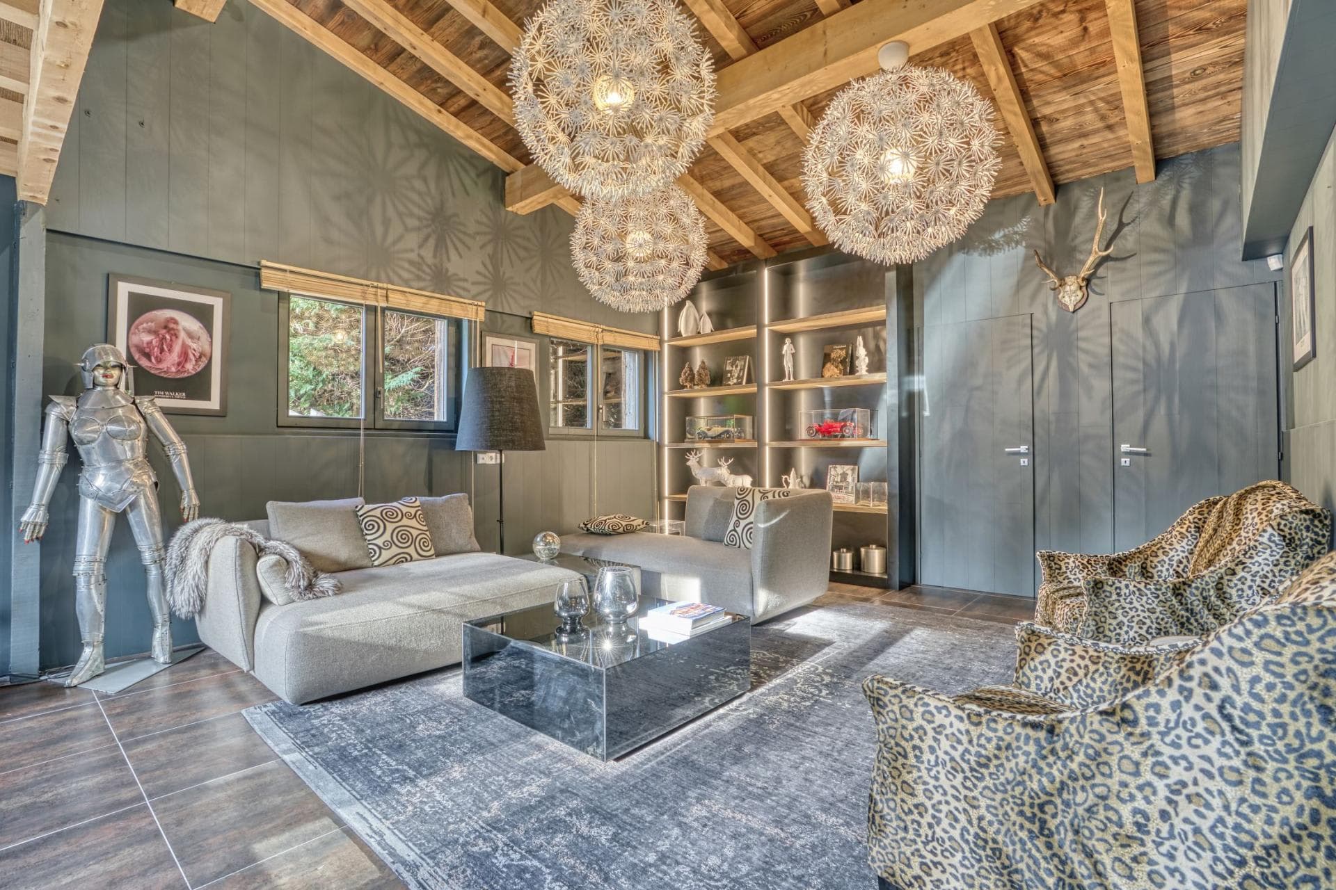 Sitting room with vaulted timber ceiling and integrated shelving