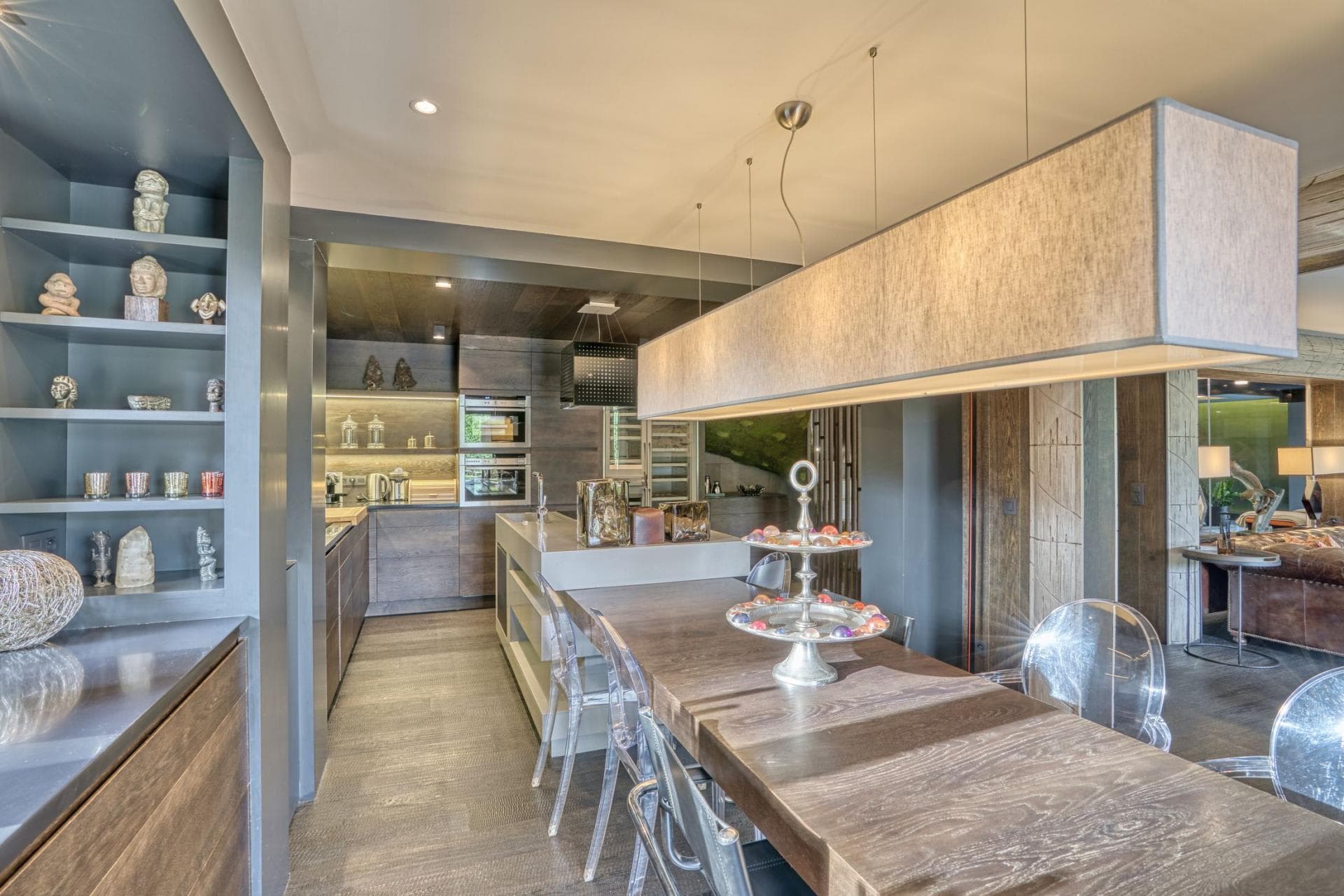 Open-concept kitchen and dining area with double wall ovens
