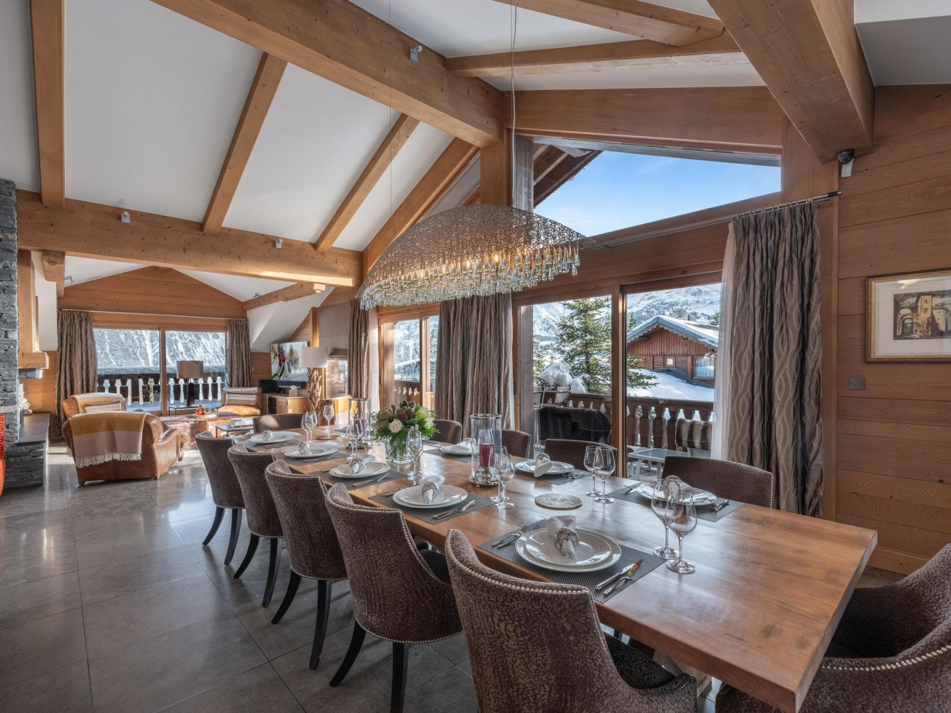 Dining area seats 12 with vaulted ceilings and mountain views