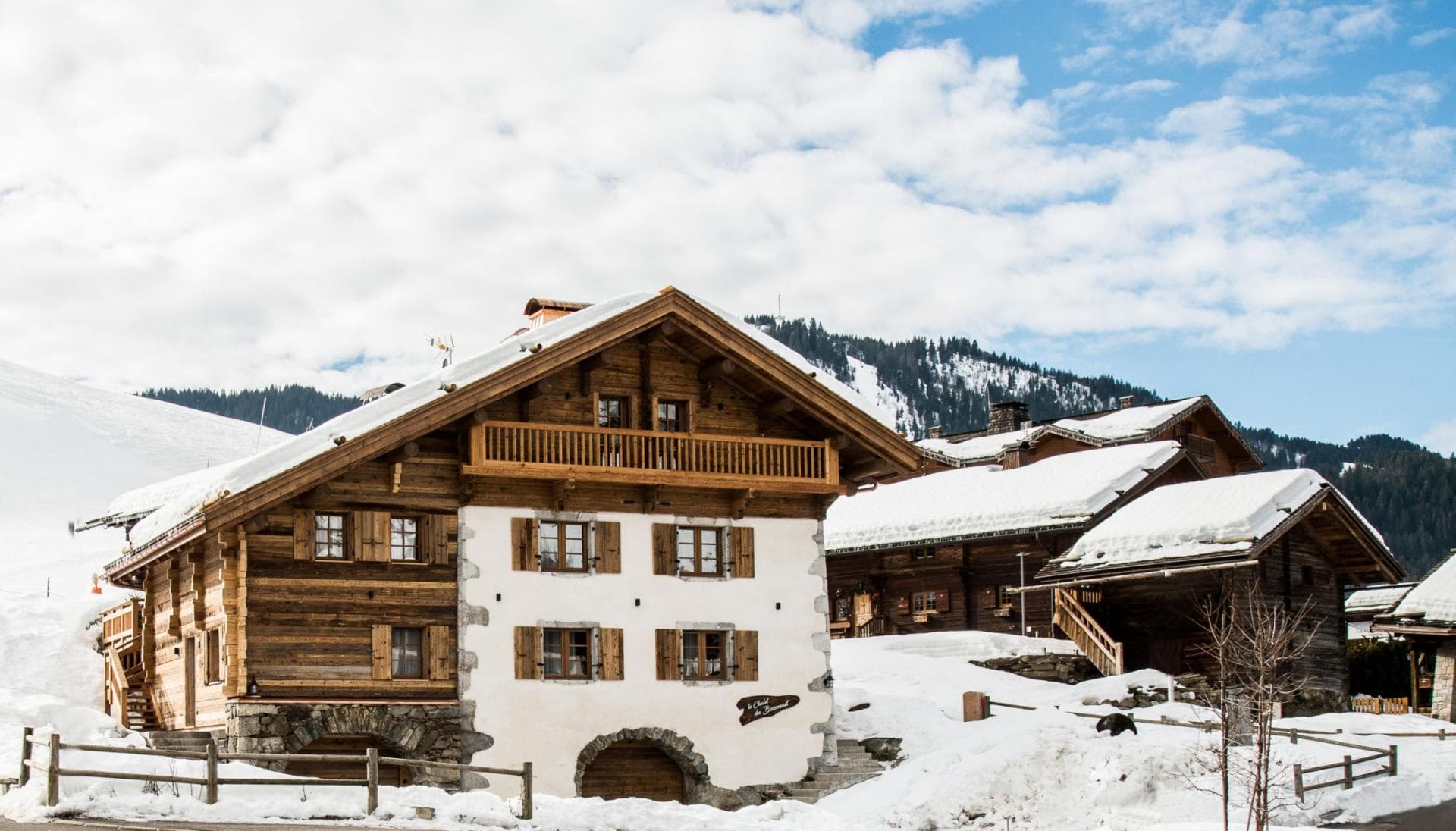 Chalet exterior with private balcony and ski slope views