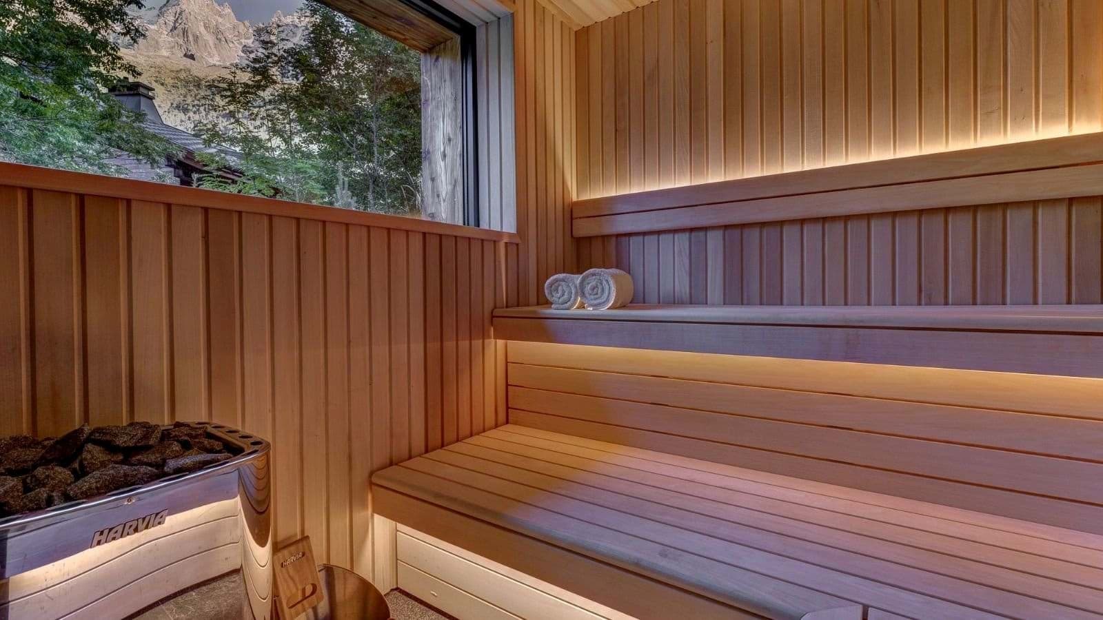 Cedar sauna with Harvia heater and mountain views
