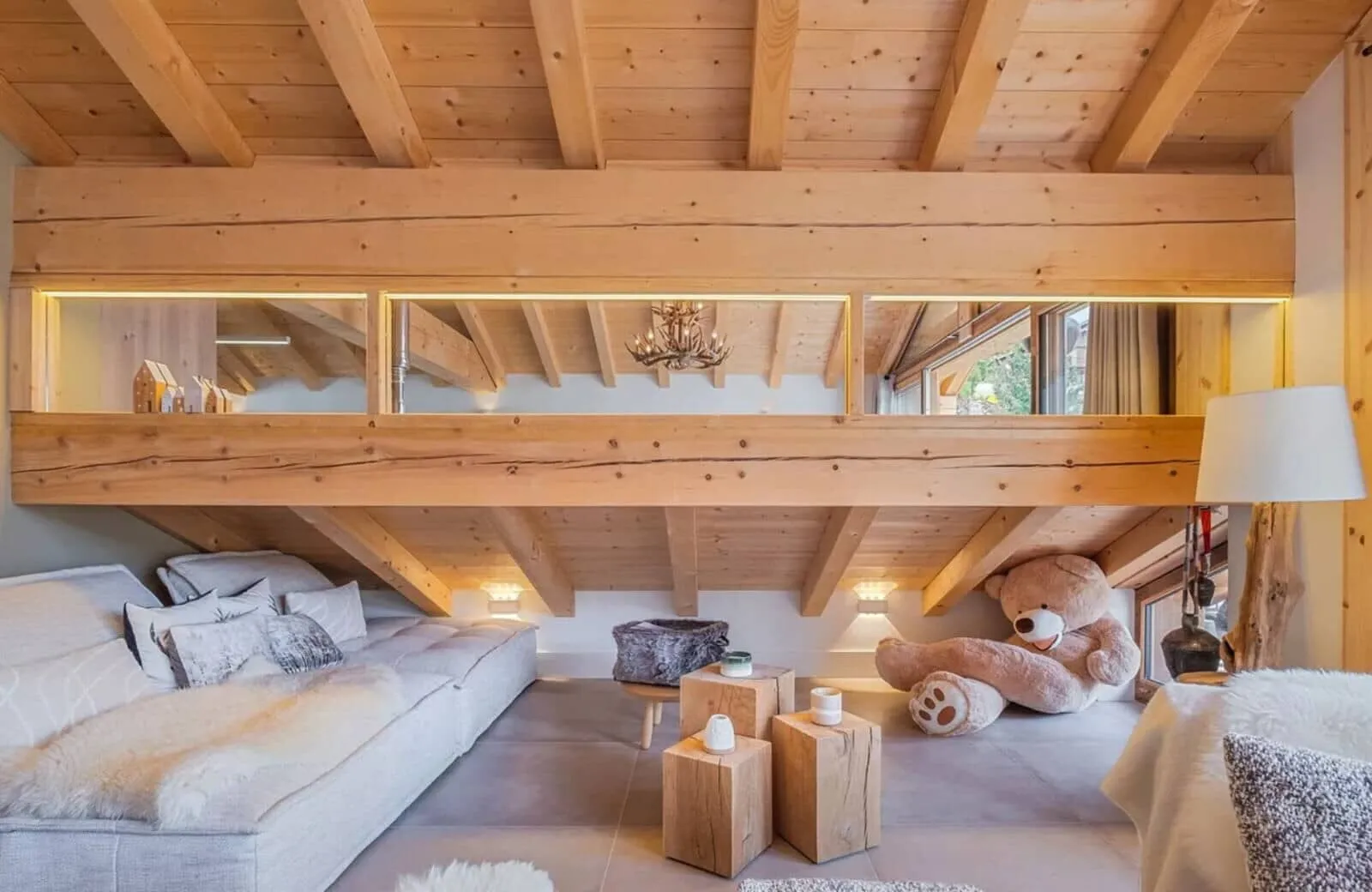 Loft lounge with modular floor seating and exposed timber beams