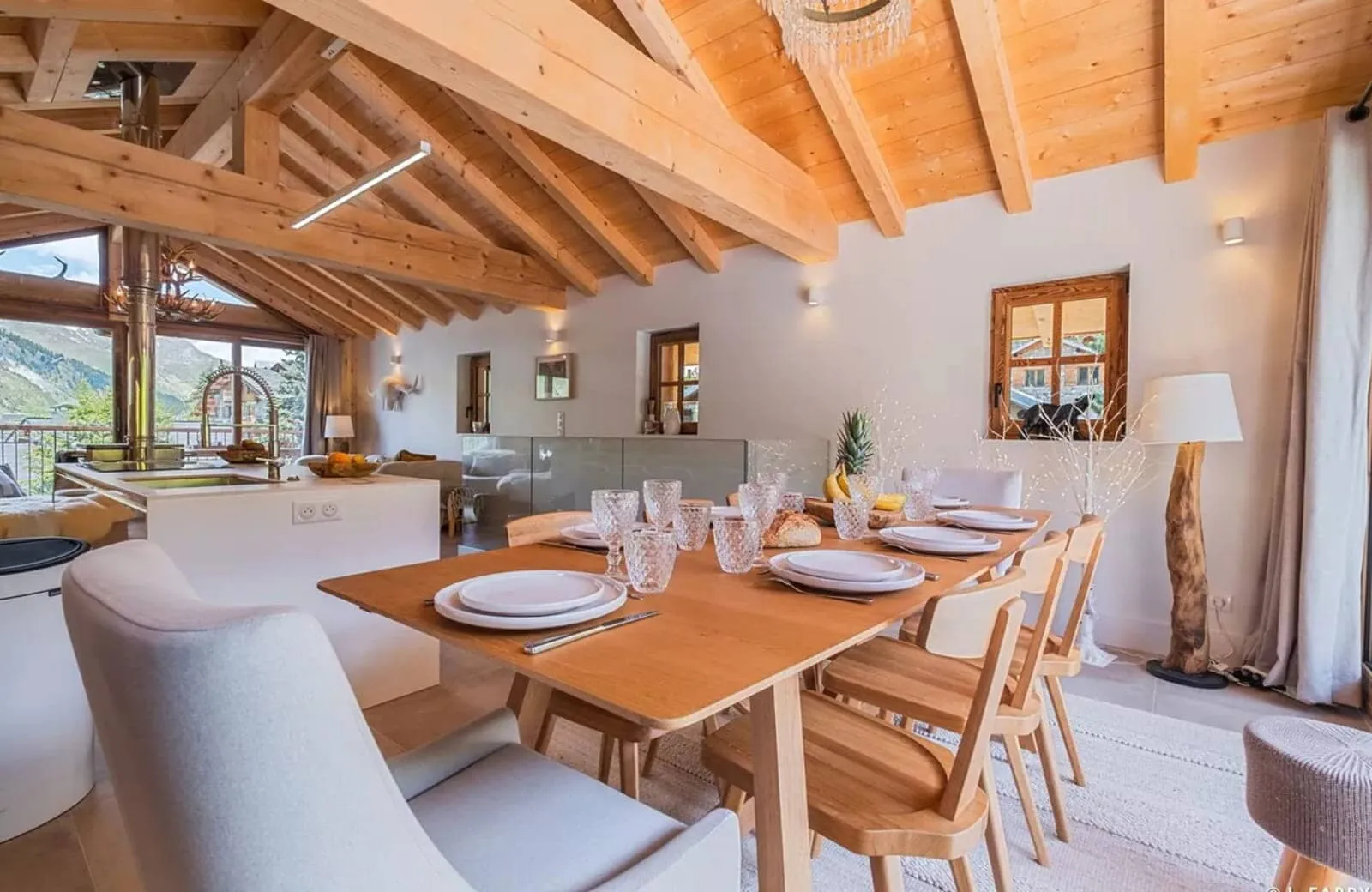 Dining area with seating for 8 under vaulted timber ceilings