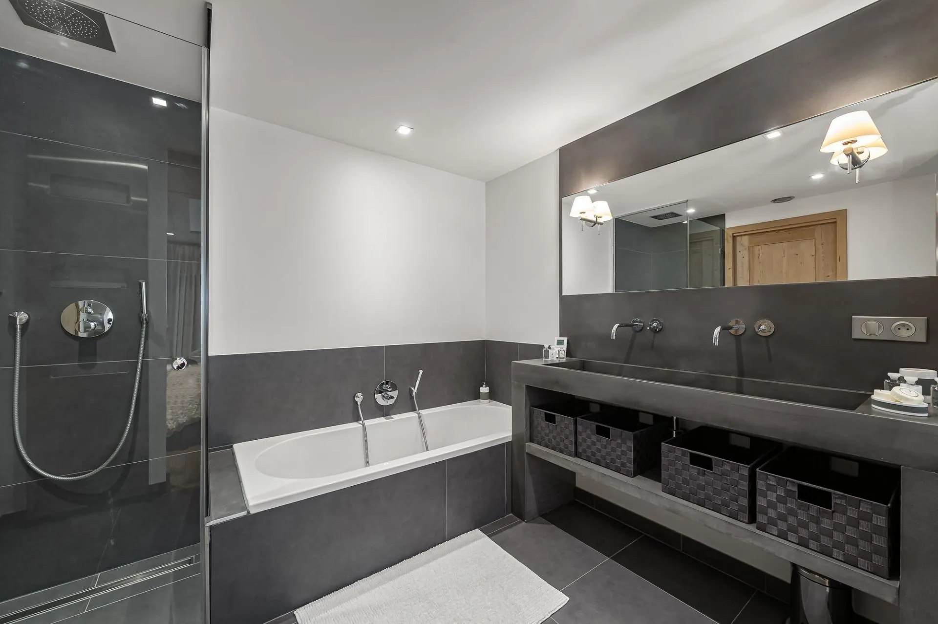 En-suite bathroom with bathtub, walk-in shower and twin basins