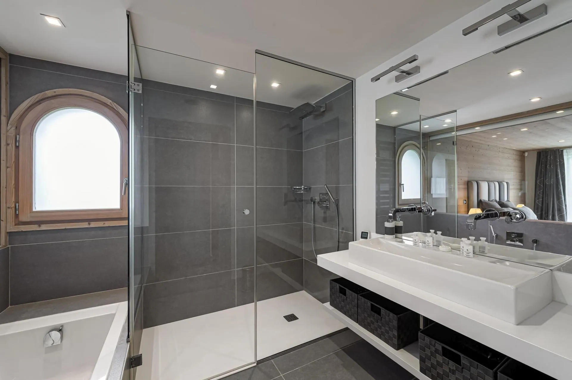 En-suite bathroom with bathtub, walk-in shower and twin basins
