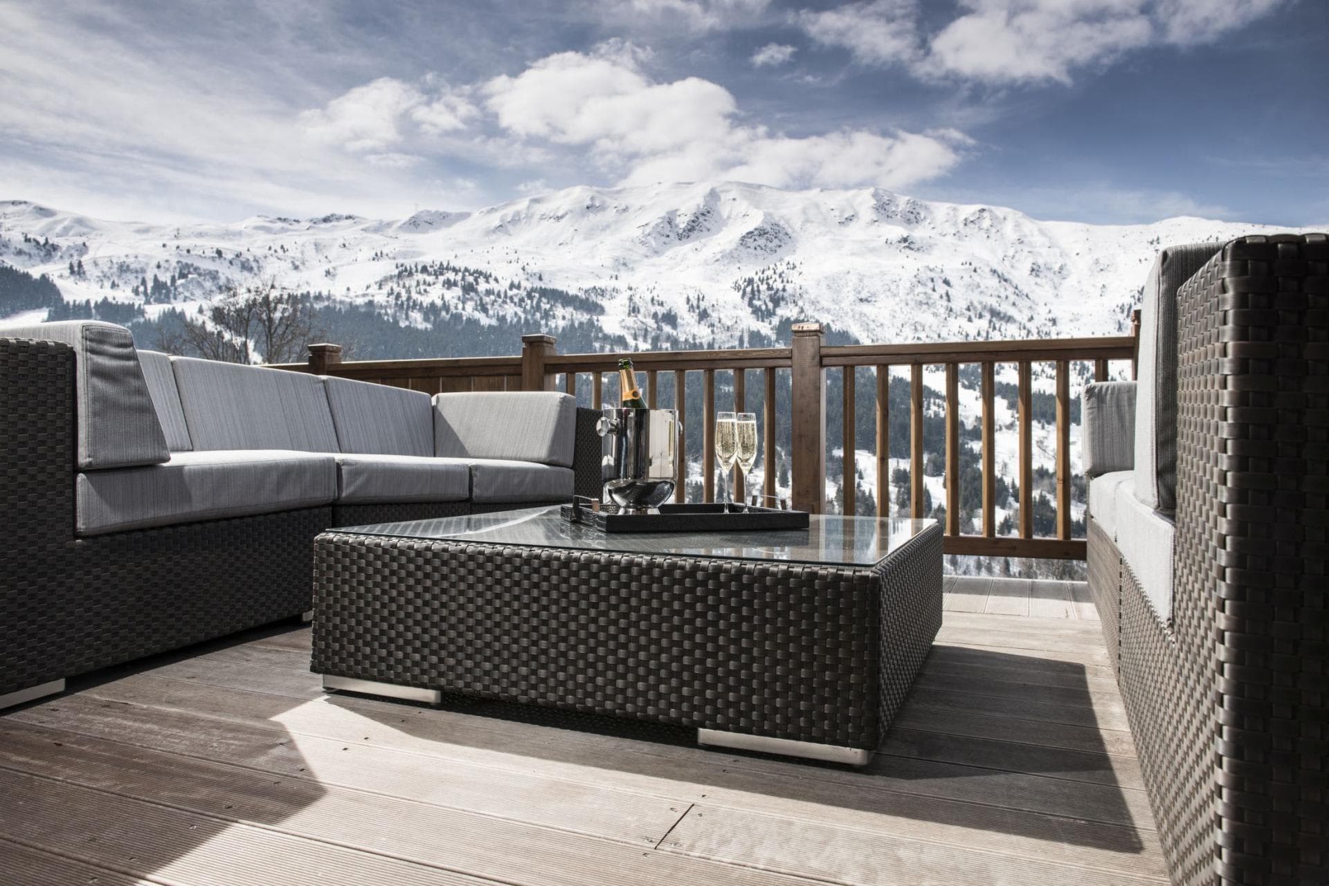 Deck with wicker sectional and mountain views
