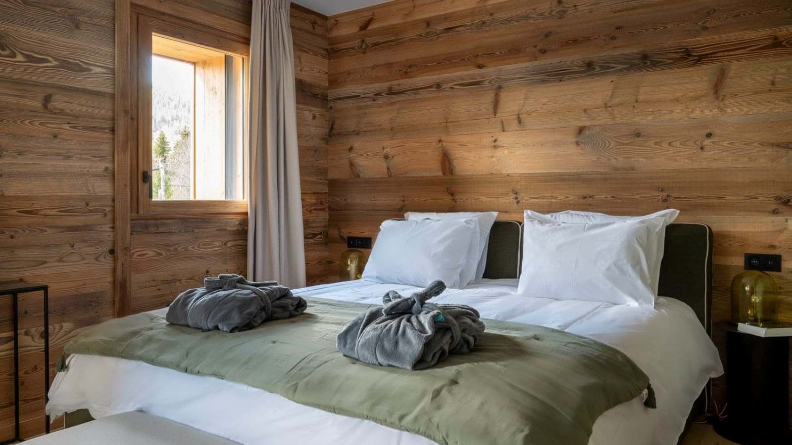 Guest bedroom with king bed and reclaimed wood walls