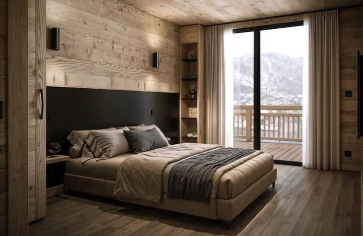 Primary bedroom with king bed and private balcony access to mountain views