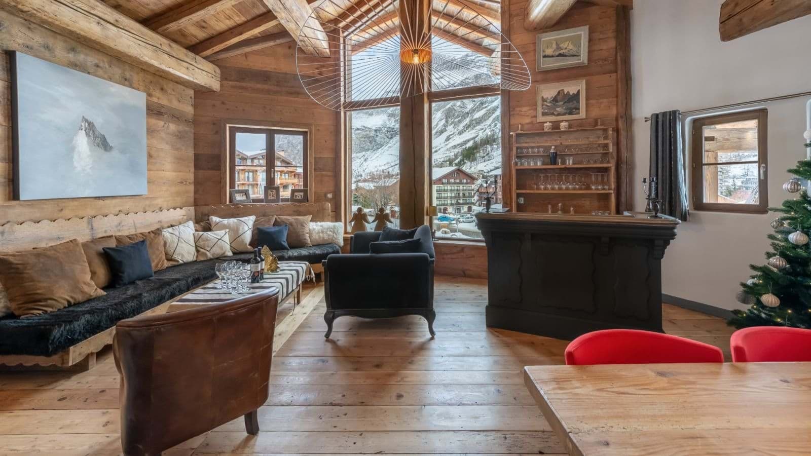Living room with valley views, bar seating, and open-concept layout to dining area