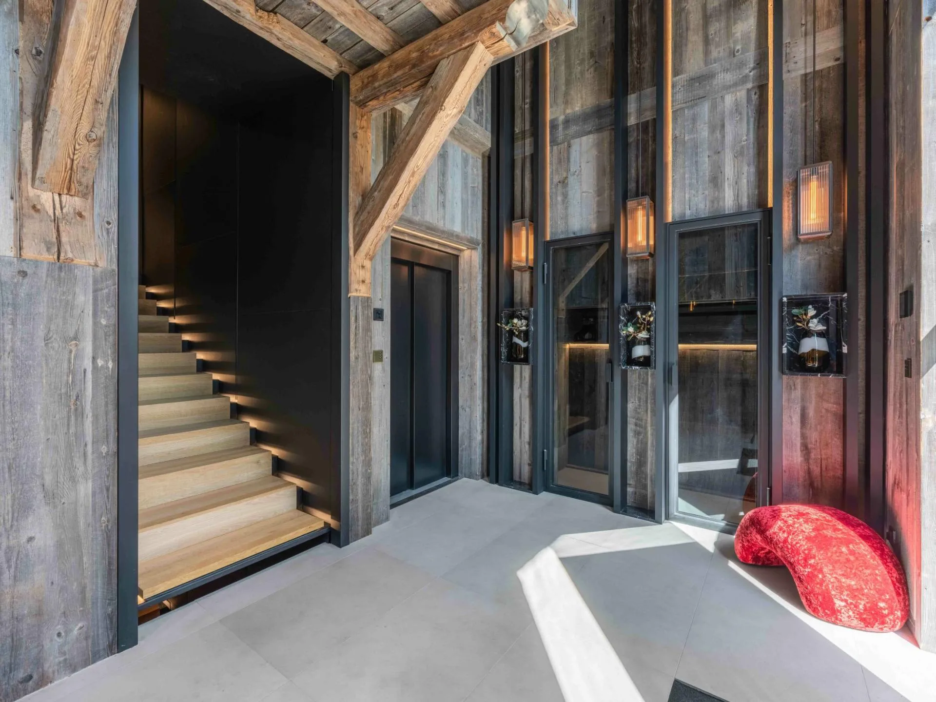 Entrance hall with staircase and elevator doors