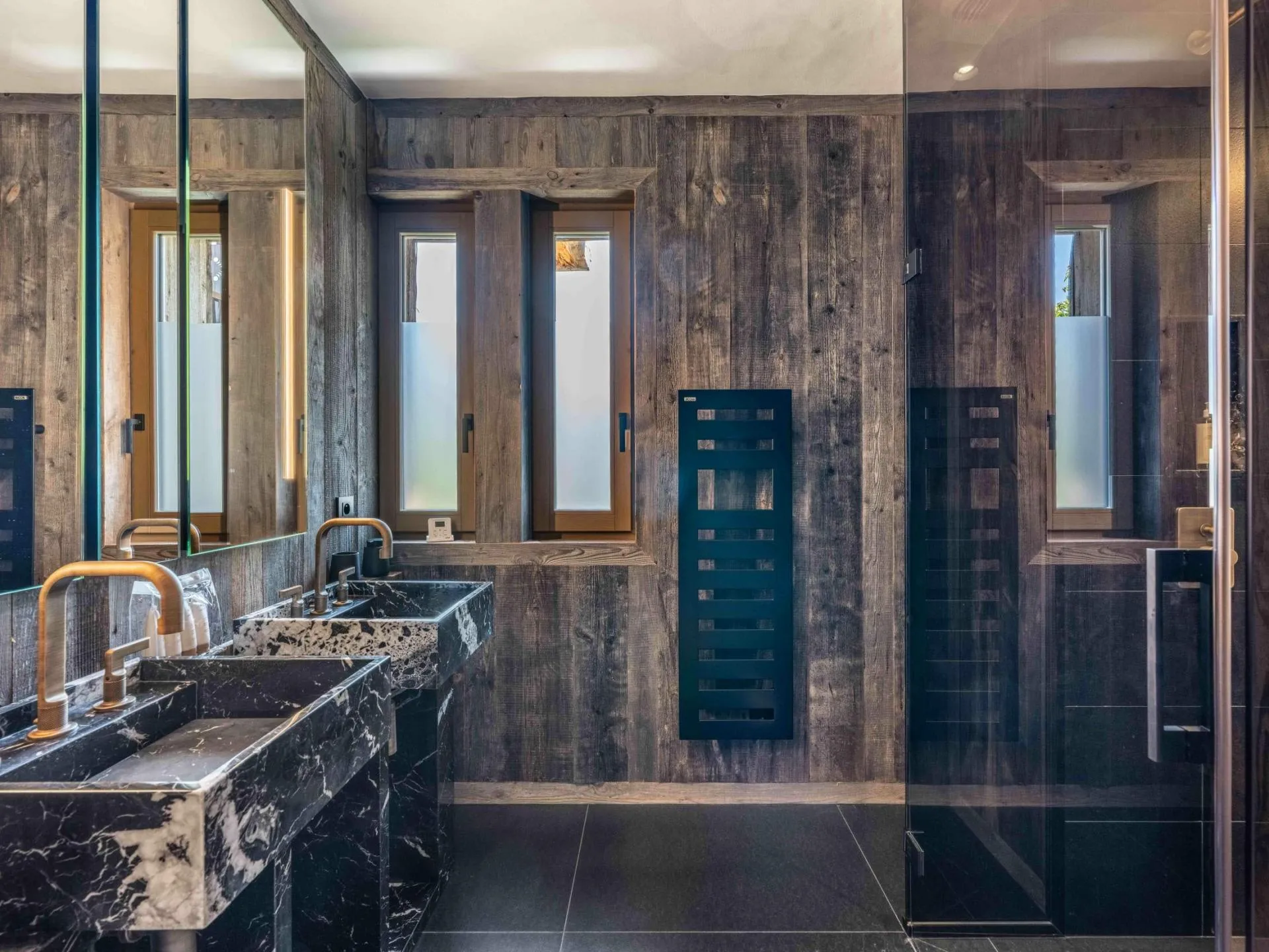 Bathroom with marble vanity and heated towel rail