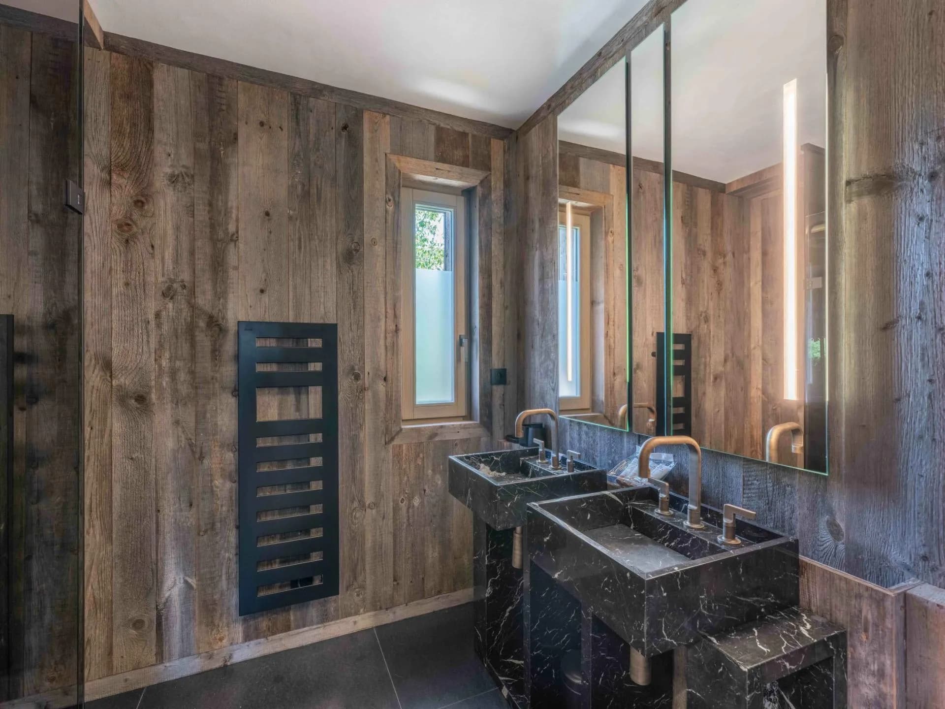 Bathroom with twin basins and heated towel rail