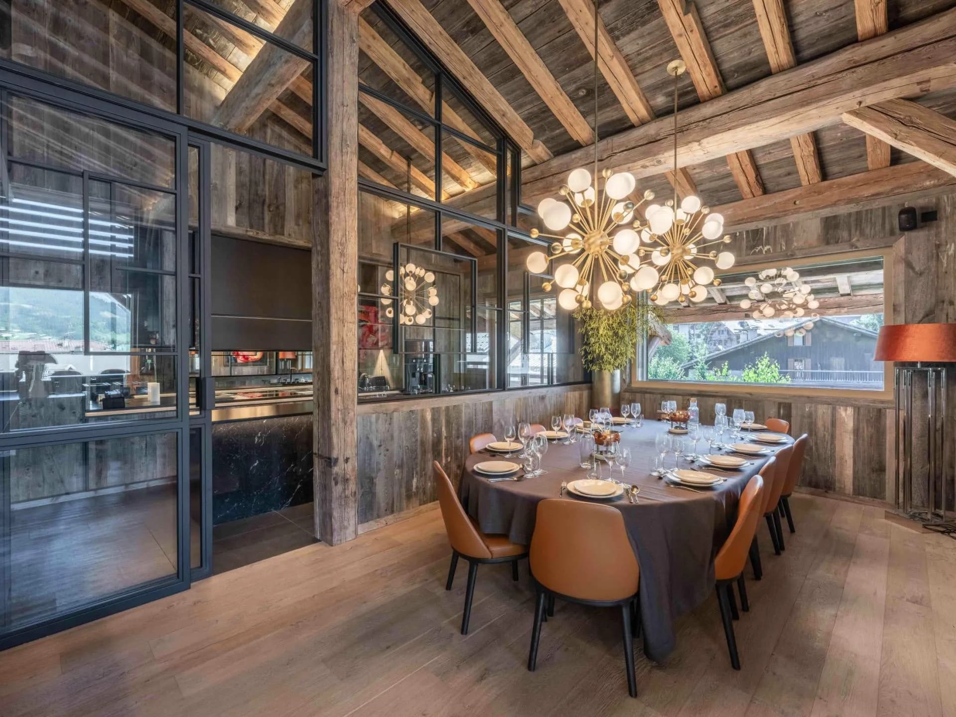 Dining table beside glass-fronted wine storage