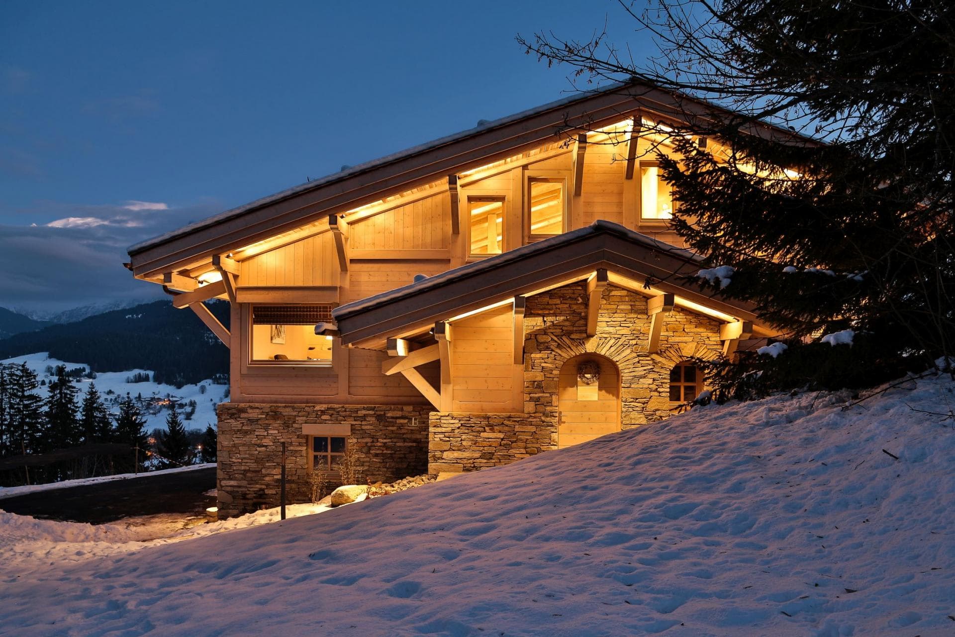 Stone and timber chalet with mountain valley views